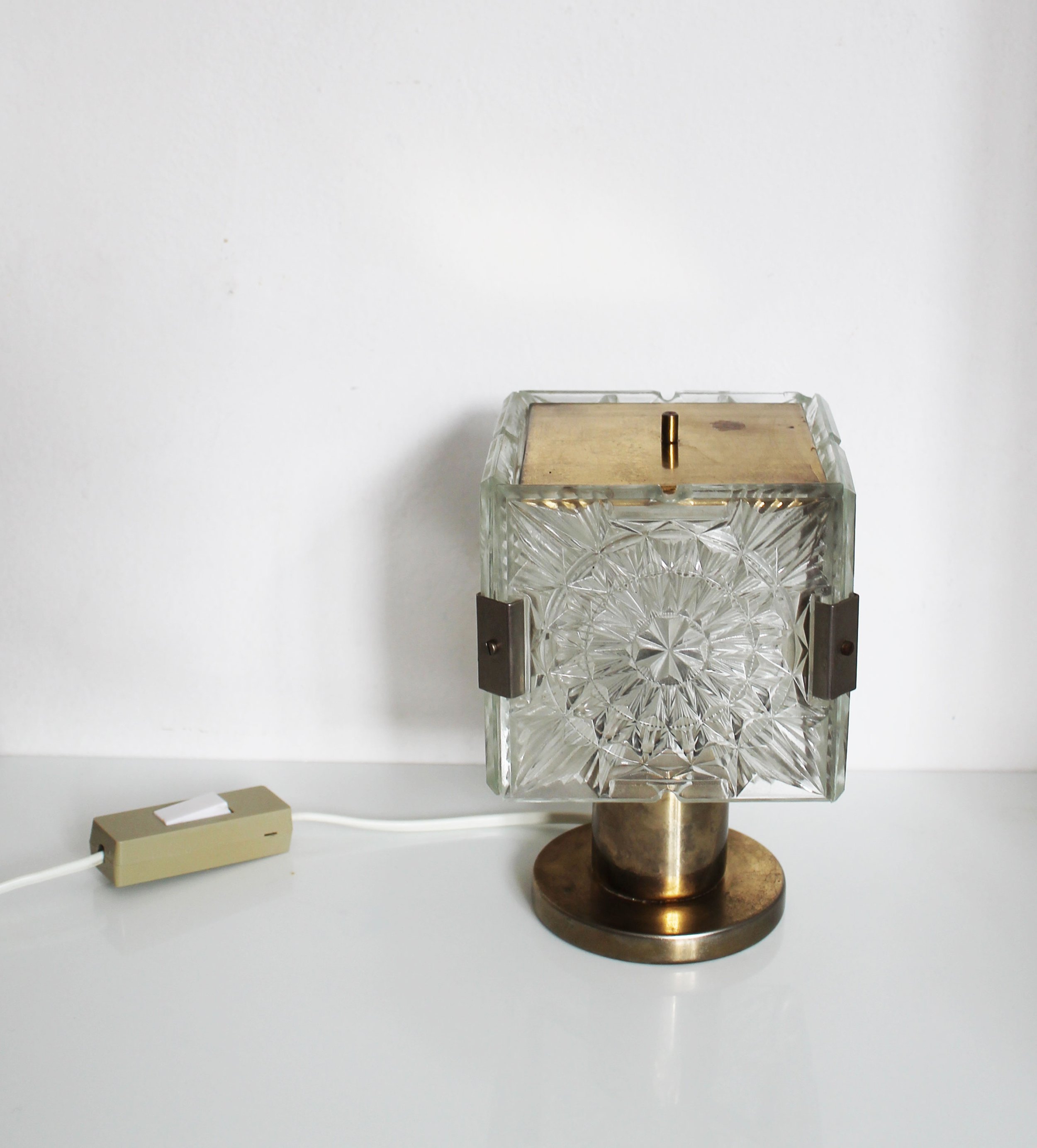 Vintage Czech crystal lamp with brass frame and geometric design.jpg