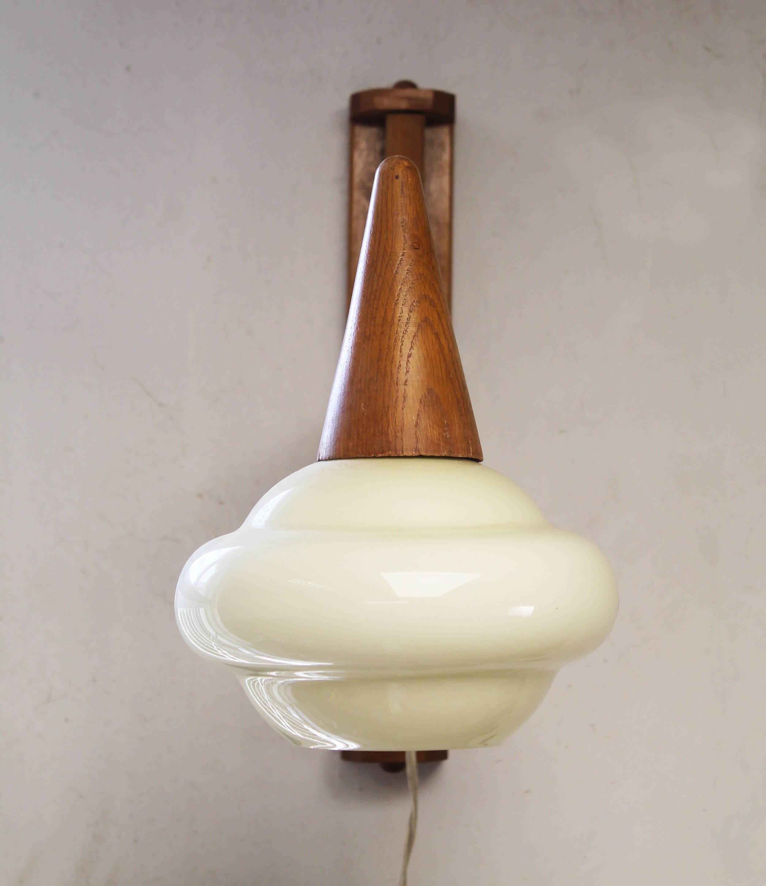Front detail of the organically curved cream opaline glass shade.jpg