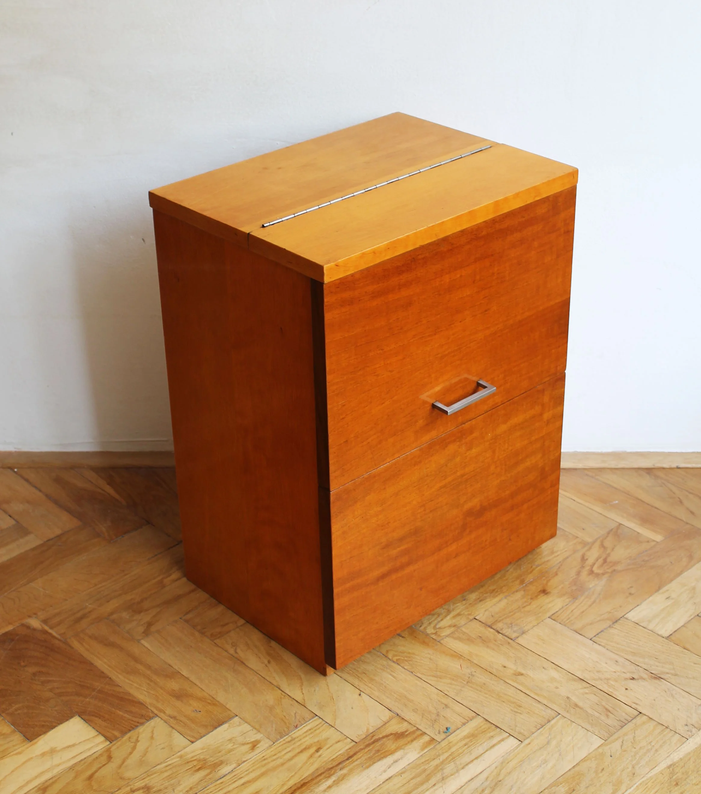 Angled side view of cabinet highlighting slim proportions