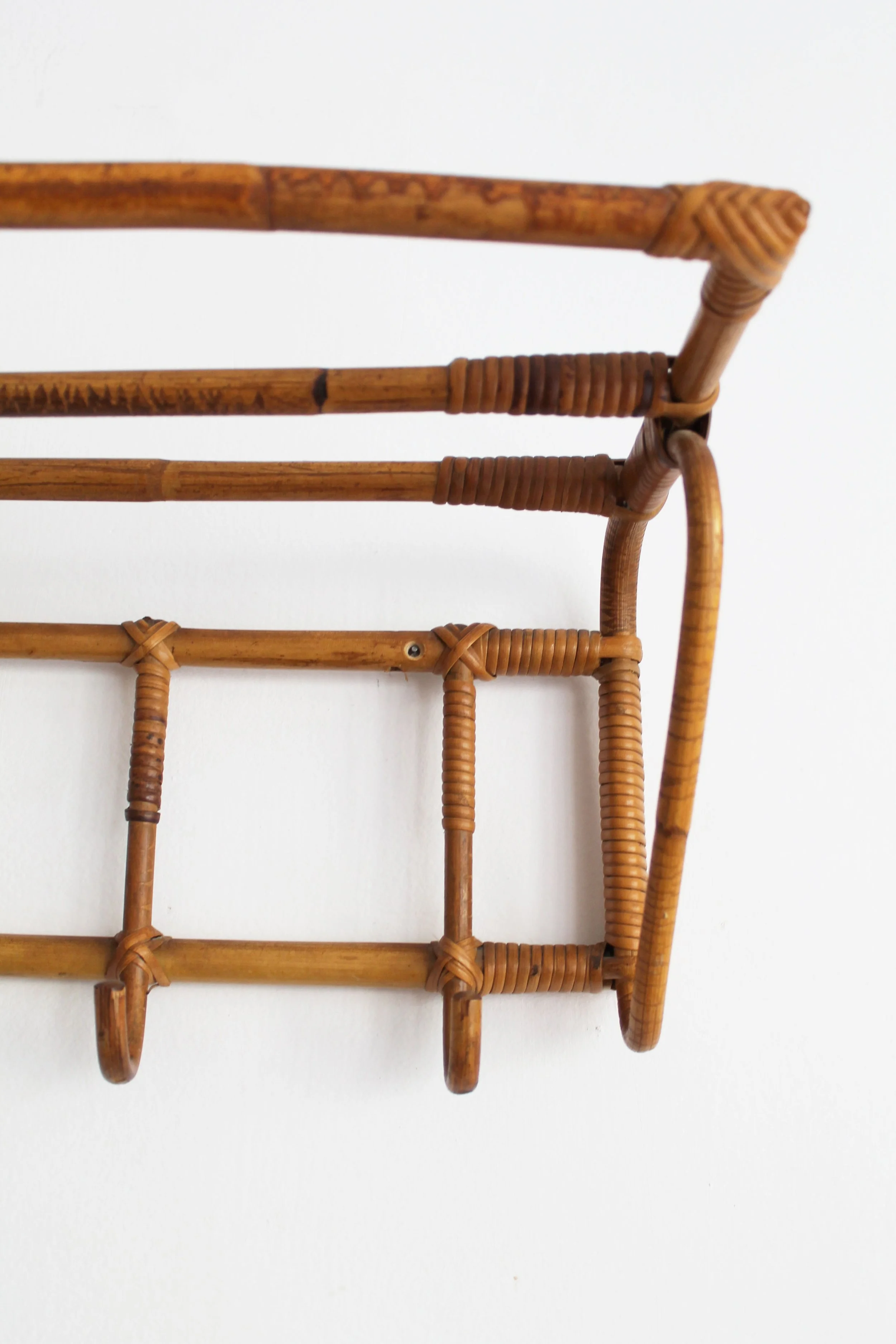 Detail of original cane, wicker wrapping and aged patina on 1960s ÚLUV attributed coat rack.jpg