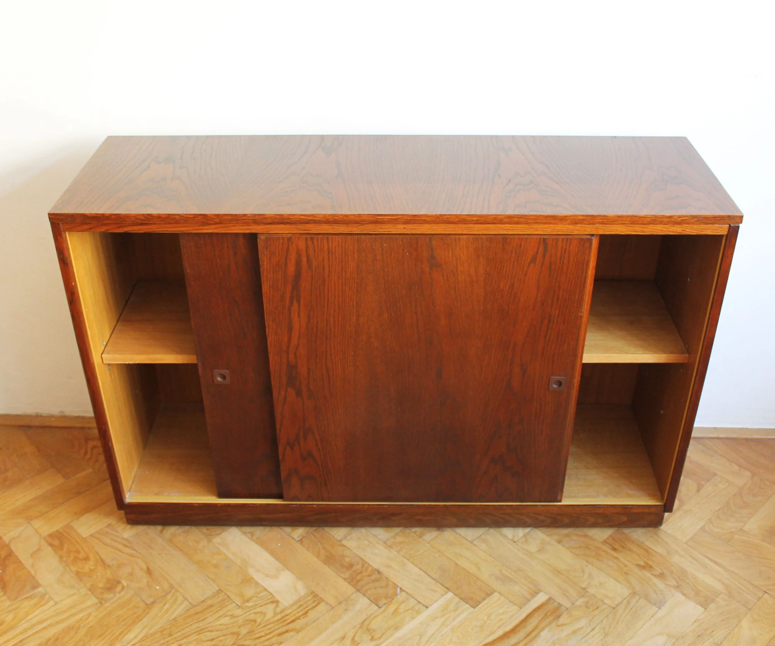Close-up of small dark plastic sliding door handle on 1966 Czechoslovak sideboard.jpg