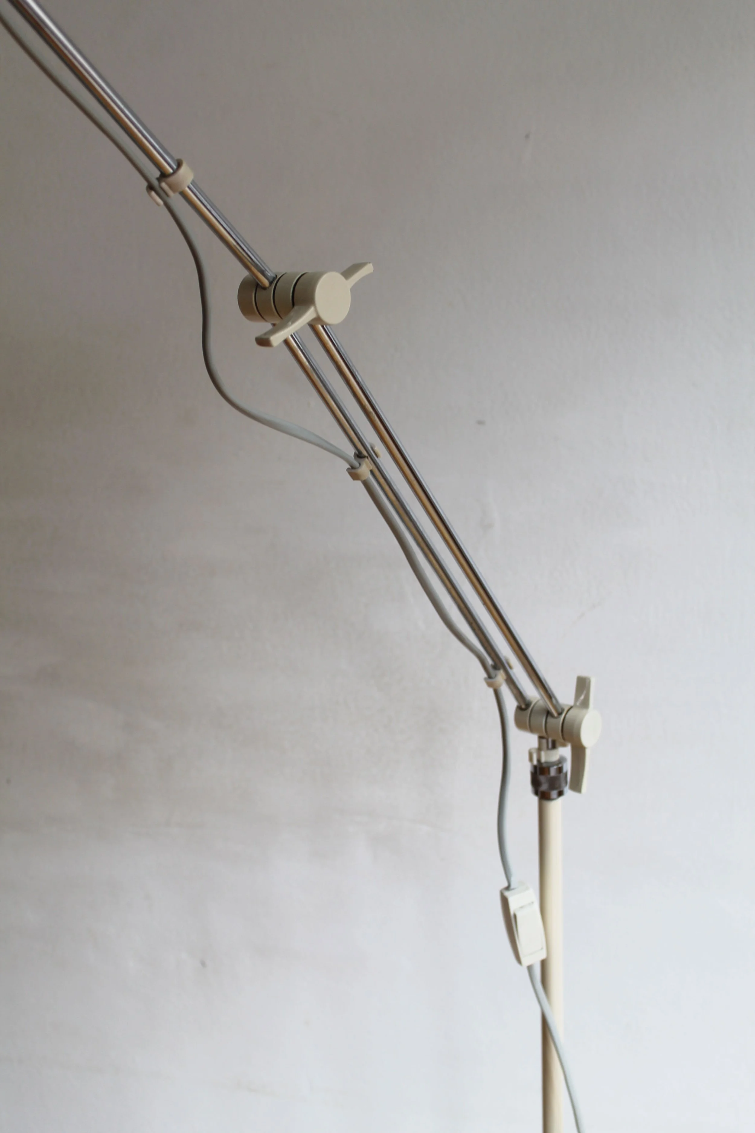 Detail of chrome joints and adjustable arm mechanism of vintage floor lamp