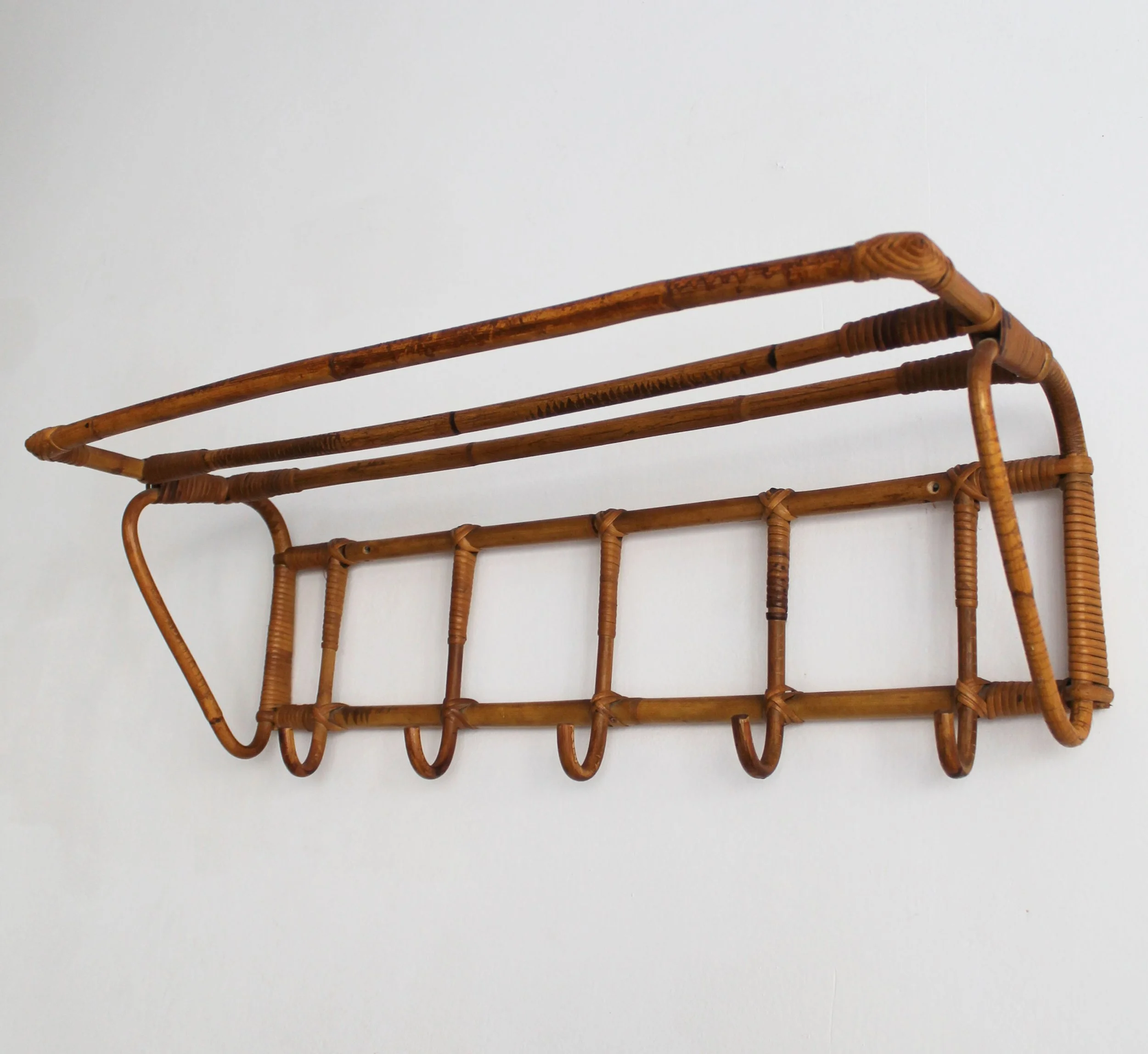 Upper rattan hat shelf and hand-wrapped joints on 1960s Czechoslovak coat rack.jpg
