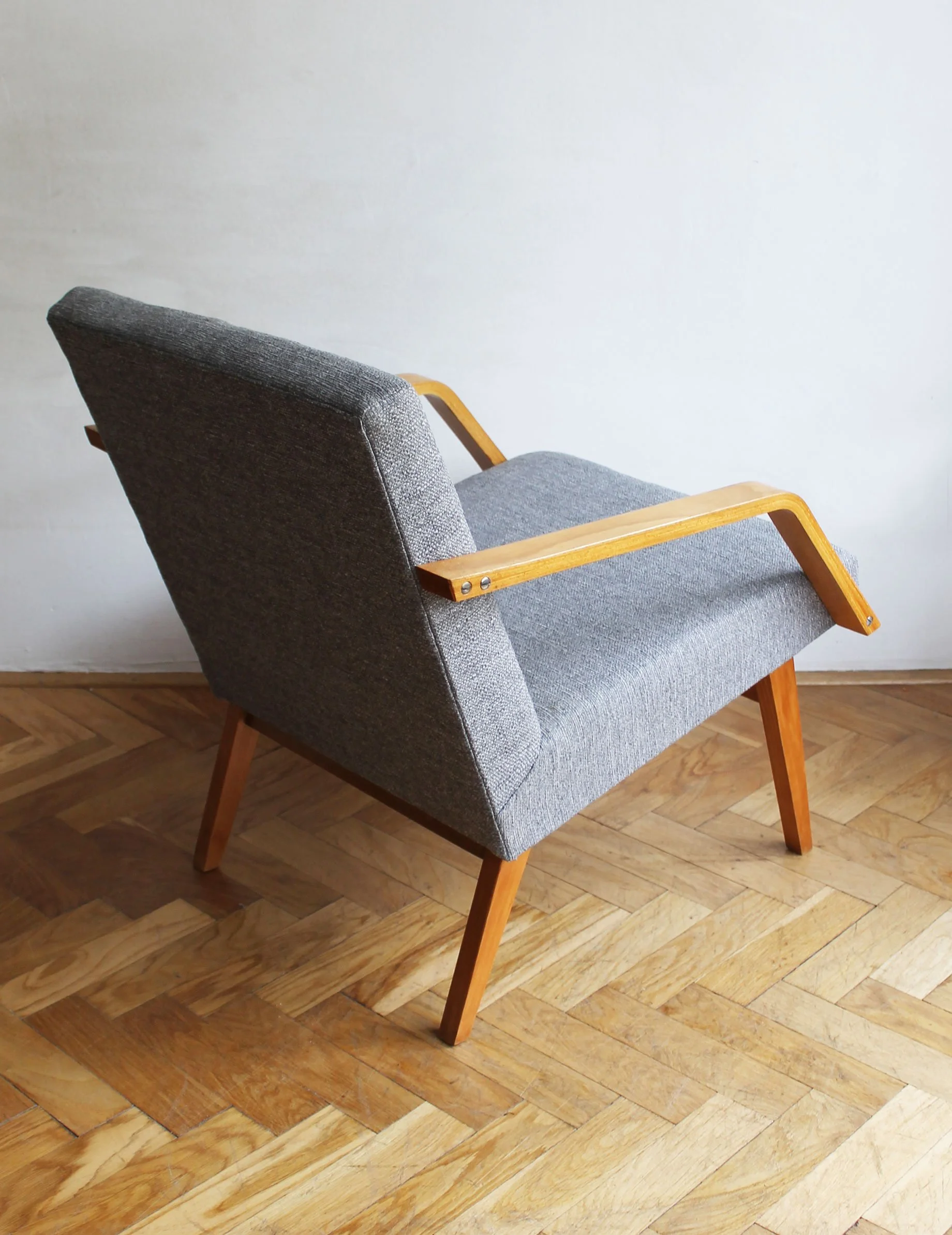 retro armchairs with sculptural armrests detail.jpg