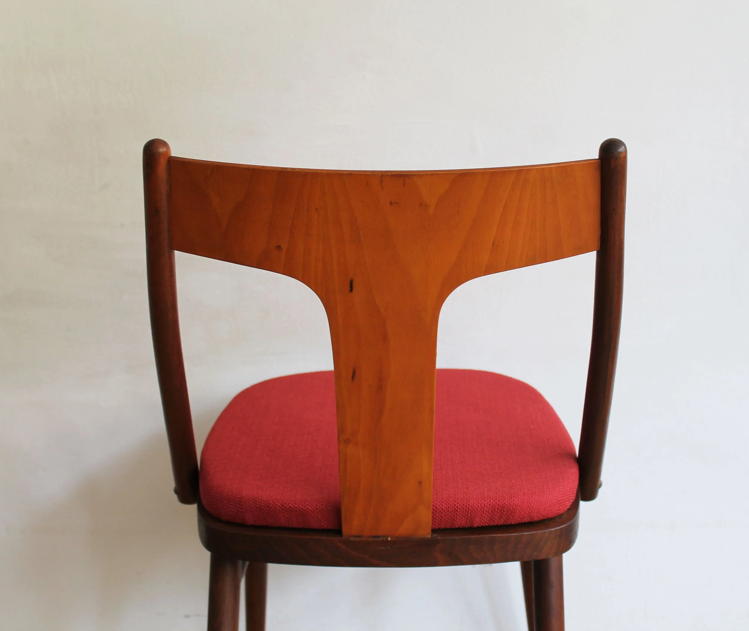 Czechoslovak modernist dining chairs with sculptural backrests.jpg