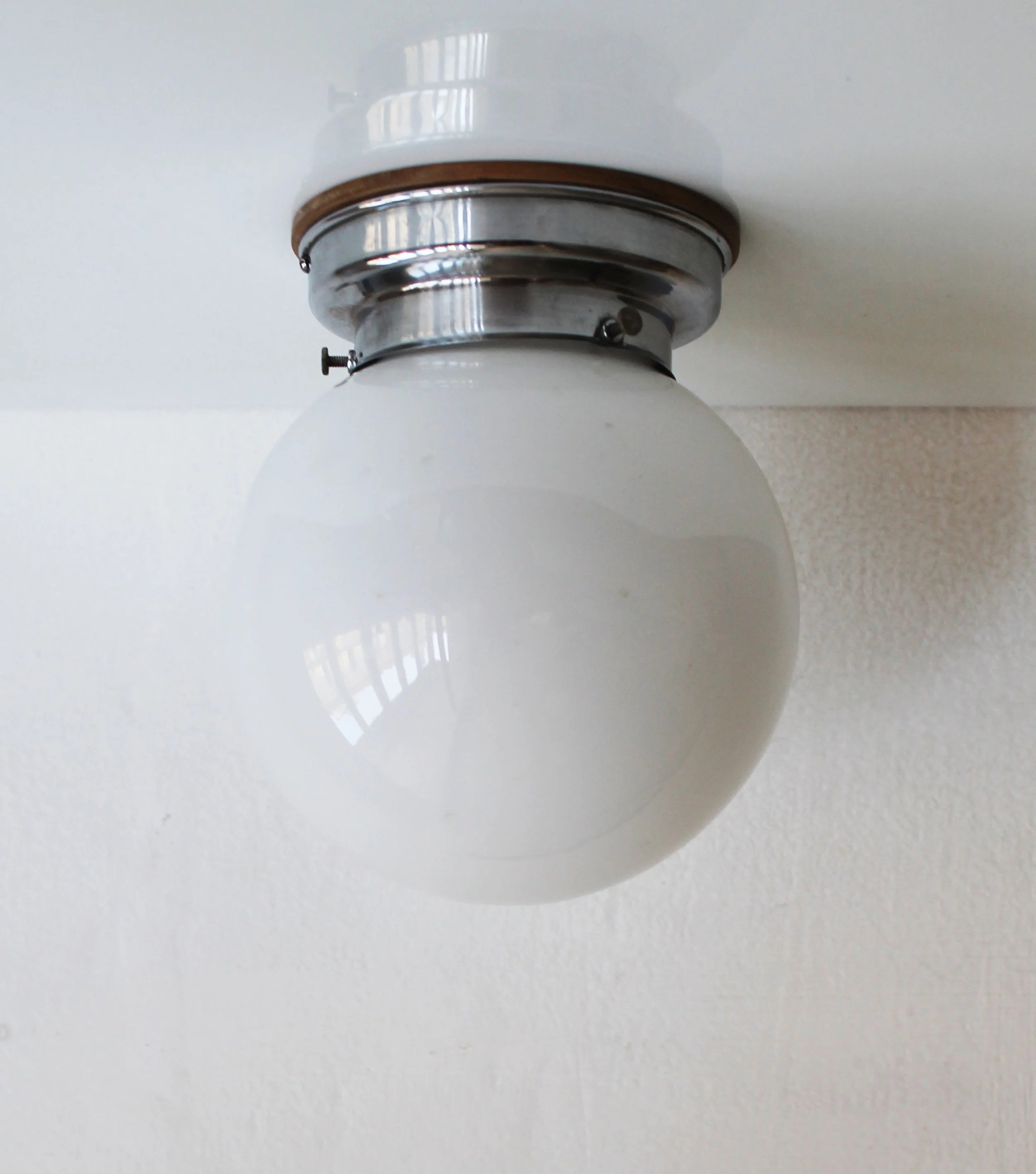 Modernist wall light steel chrome and wood detail.jpg