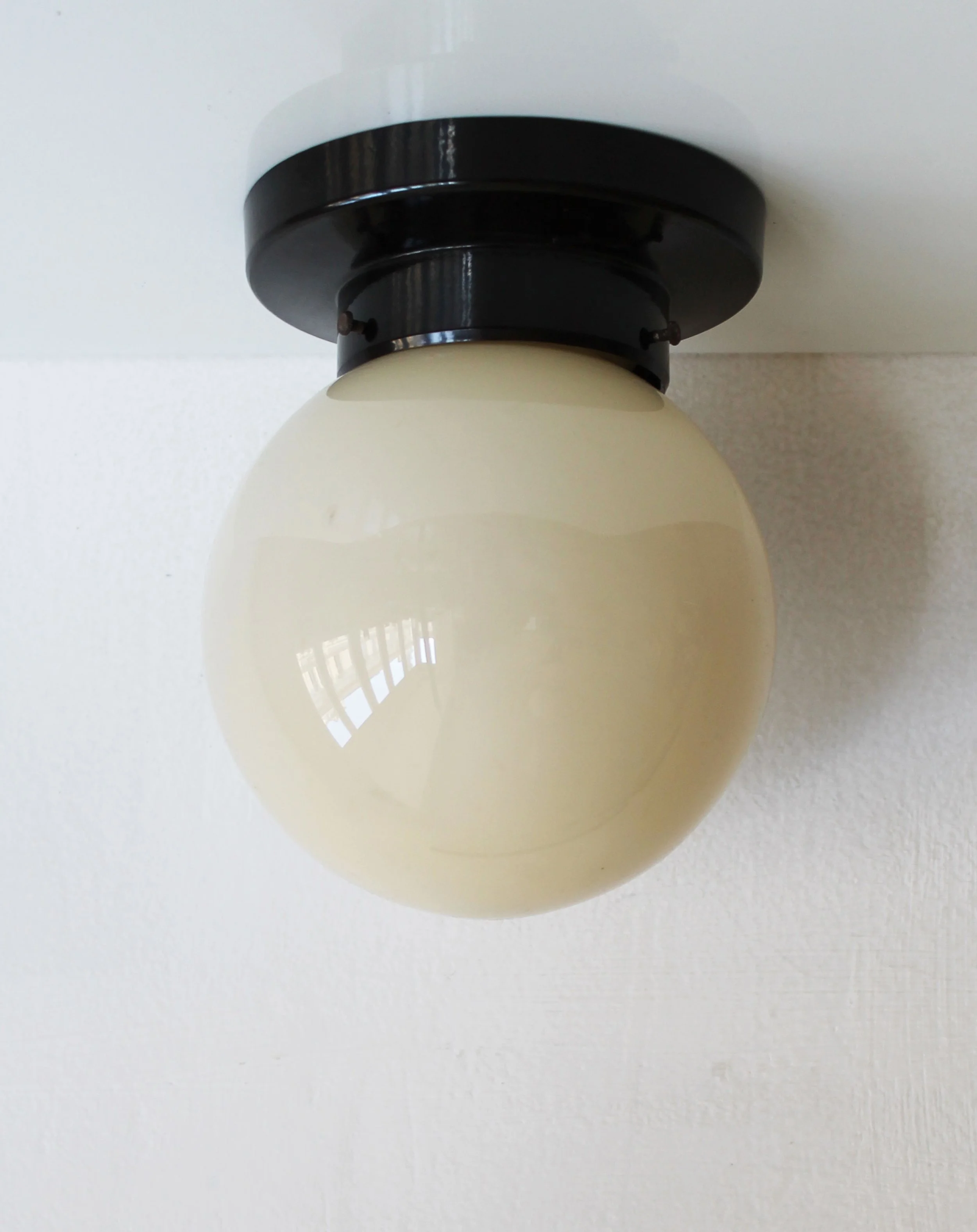 Vintage functionalist bakelite wall lamp 1930s.jpg
