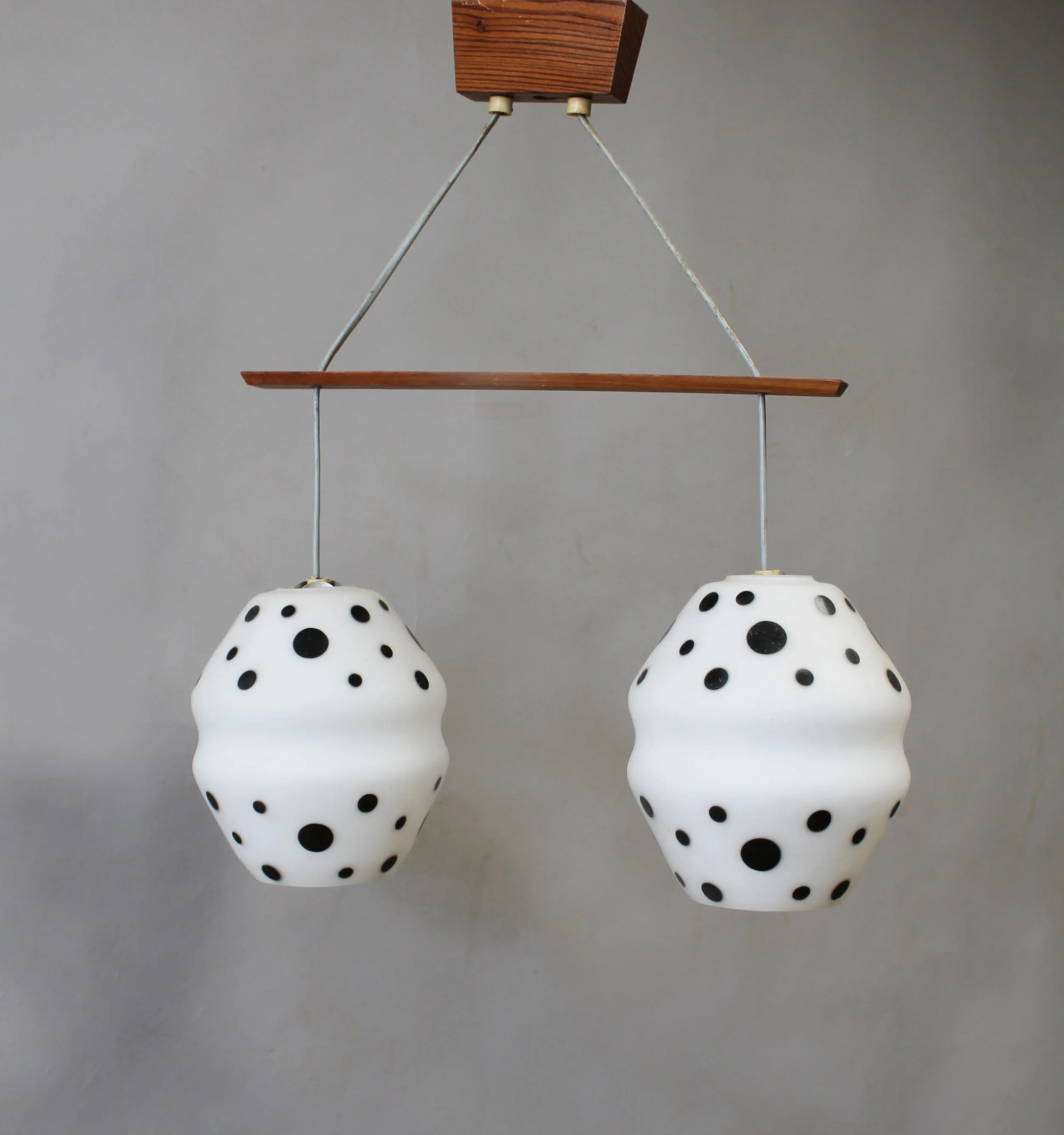 Side view of 1960s Czechoslovak double pendant light with spotted opaline glass shades
