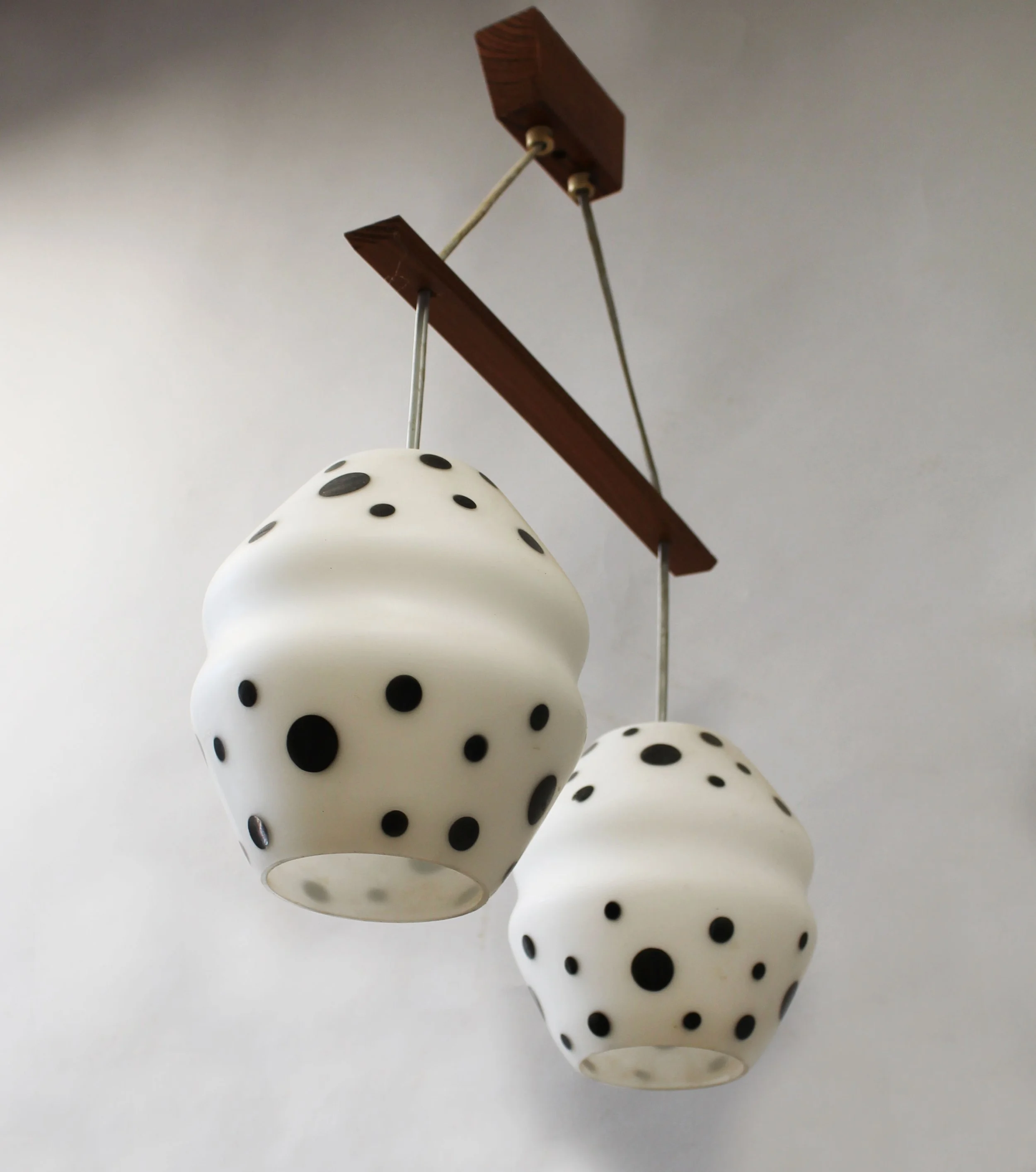 Close-up of white opaline glass and irregular black glass decoration on vintage pendant shade
