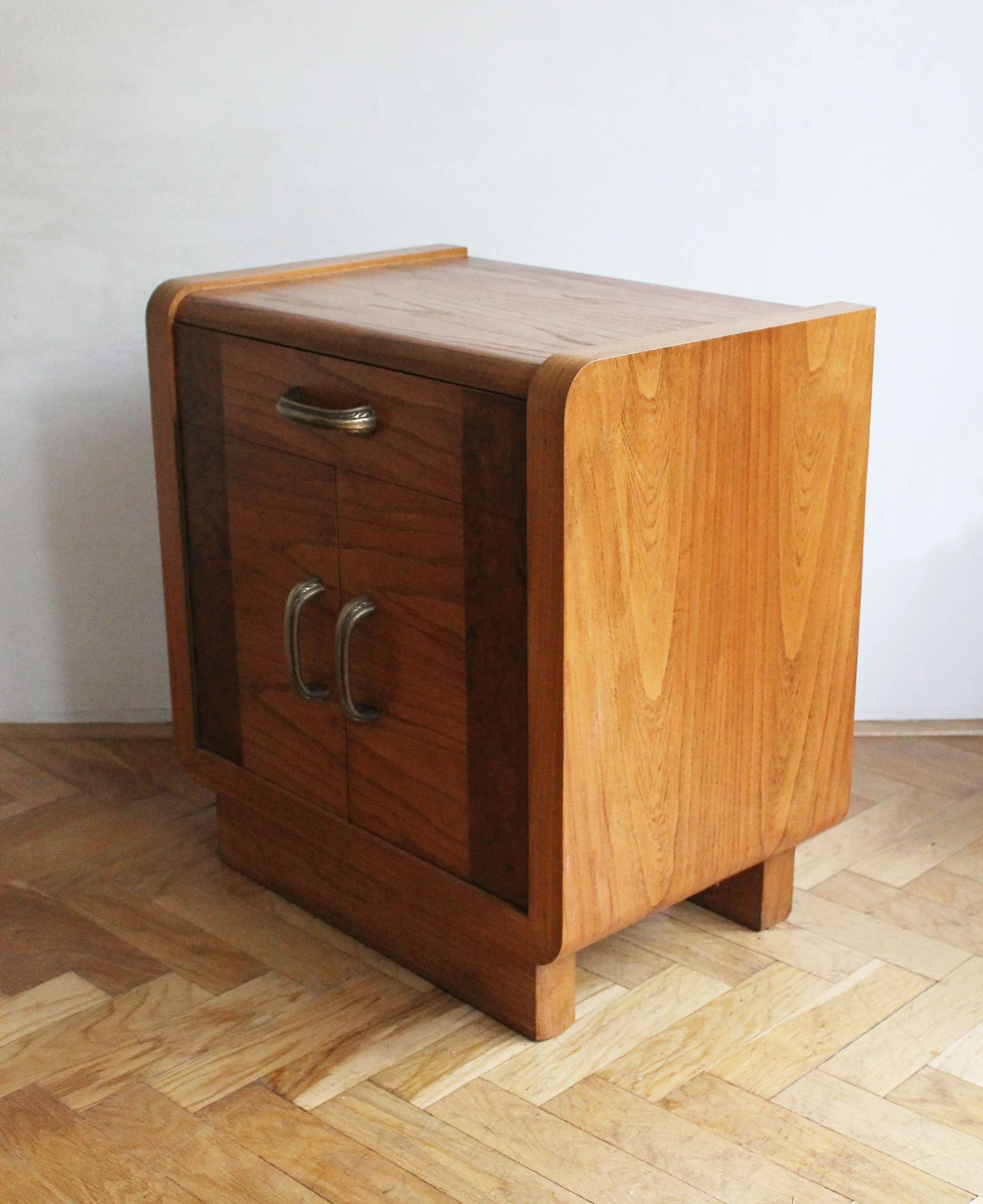 Pair of vintage bedside tables with soft, rounded edges.jpg