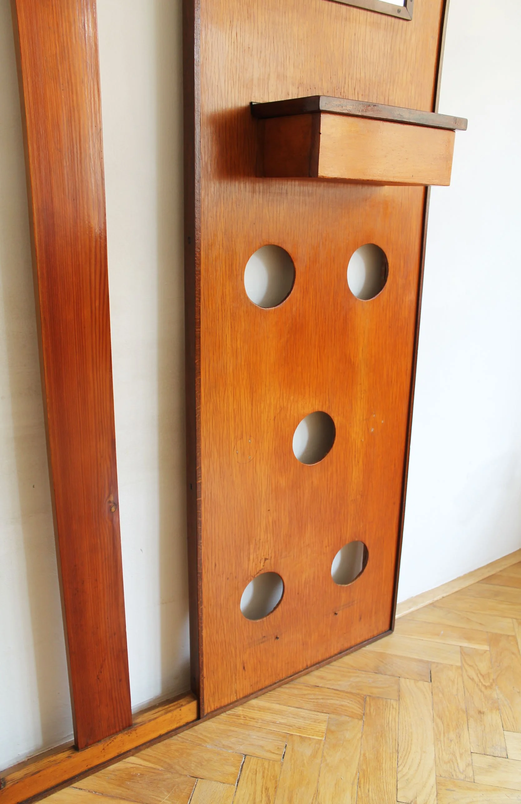 Original 1960s wall panel with coat hooks, mirror, and key compartment in aged wood.jpg (Copy)
