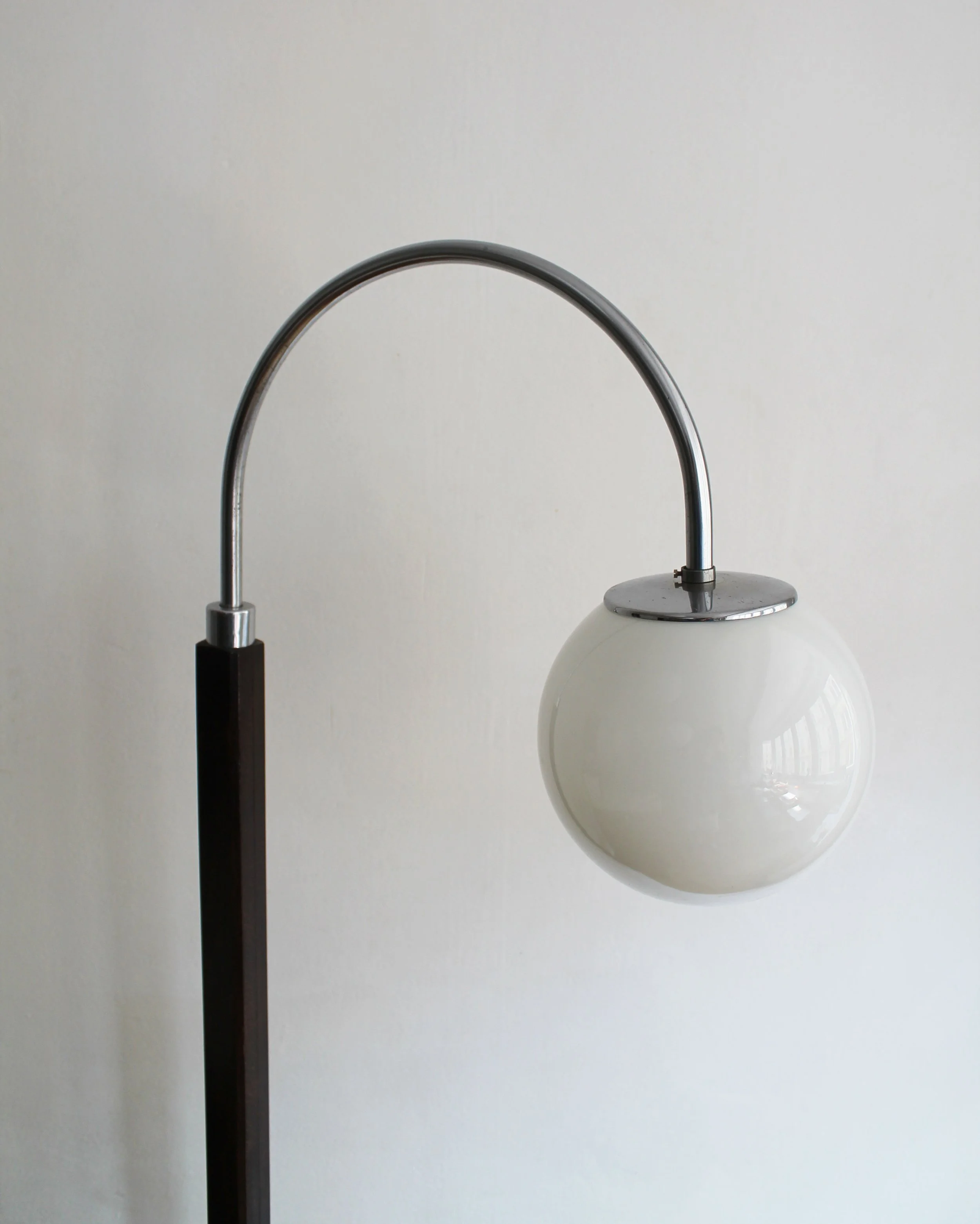Elegant 1950s Czech floor lamp with wooden structure and glass globe light.jpg
