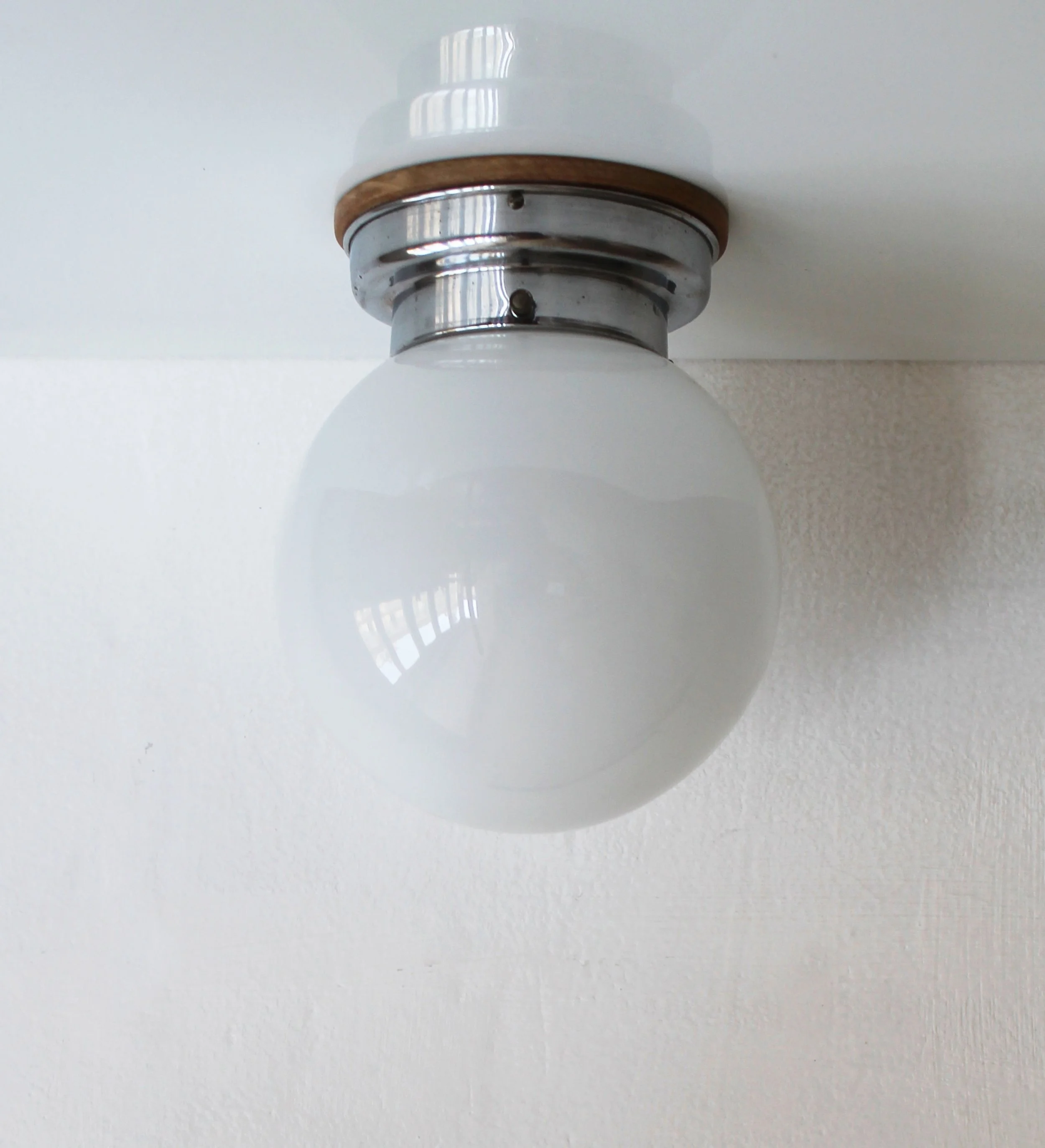 Art Deco modernist wall light with opaline glass globe.jpg