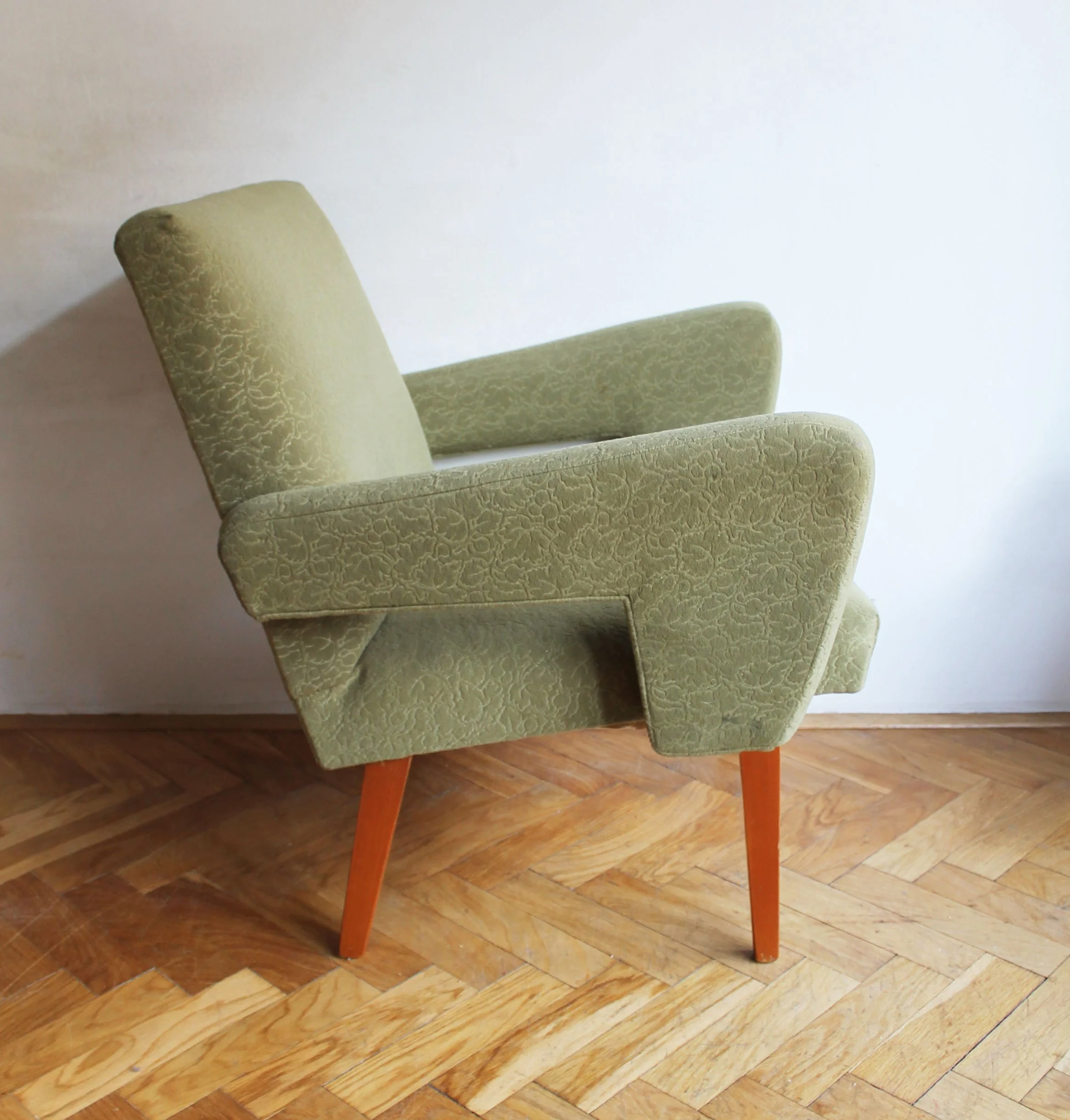 Original 1960s green fabric upholstery with leaf-like texture.jpg