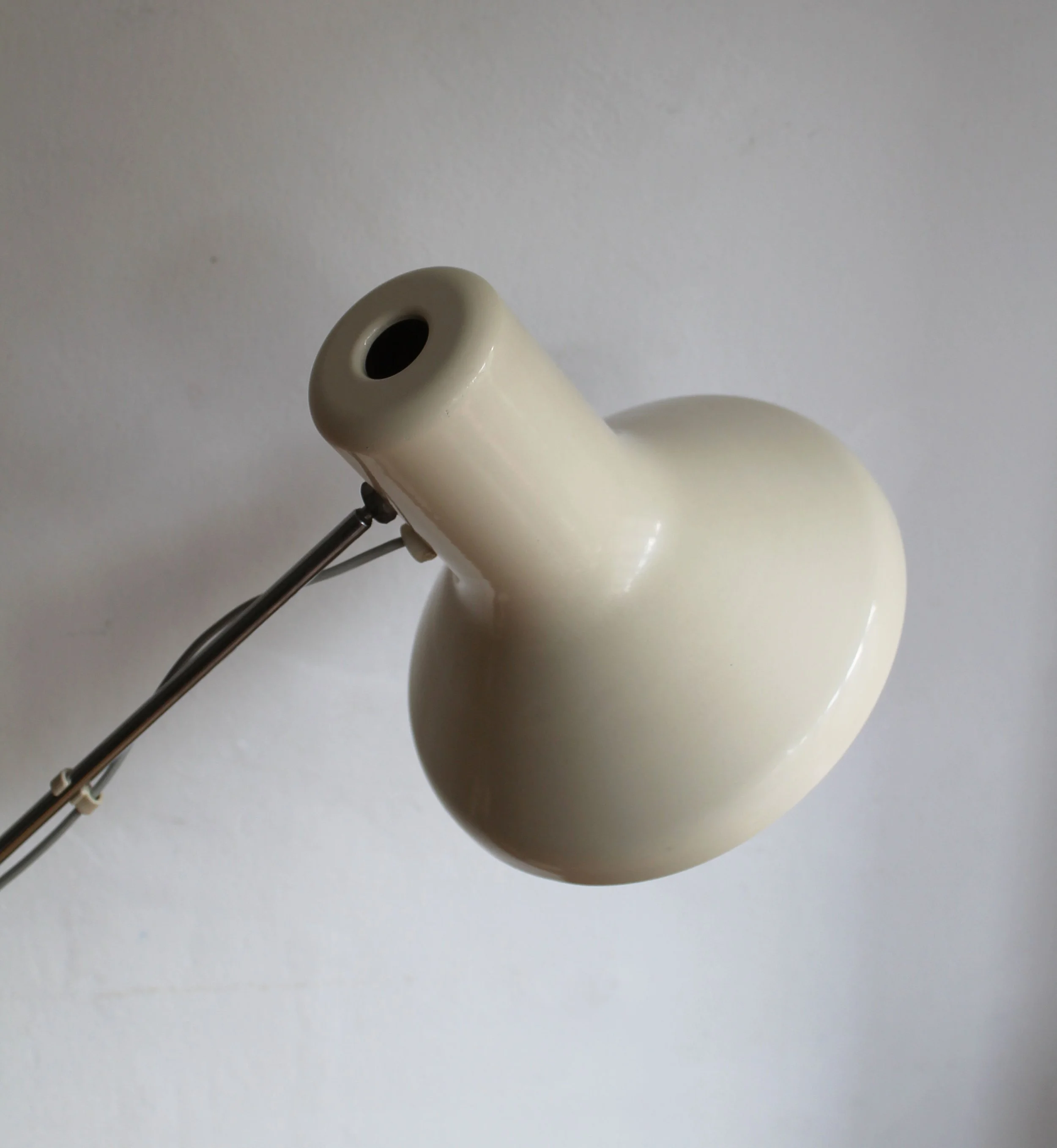 Close-up of interior lampshade showing cream finish and bulb socket