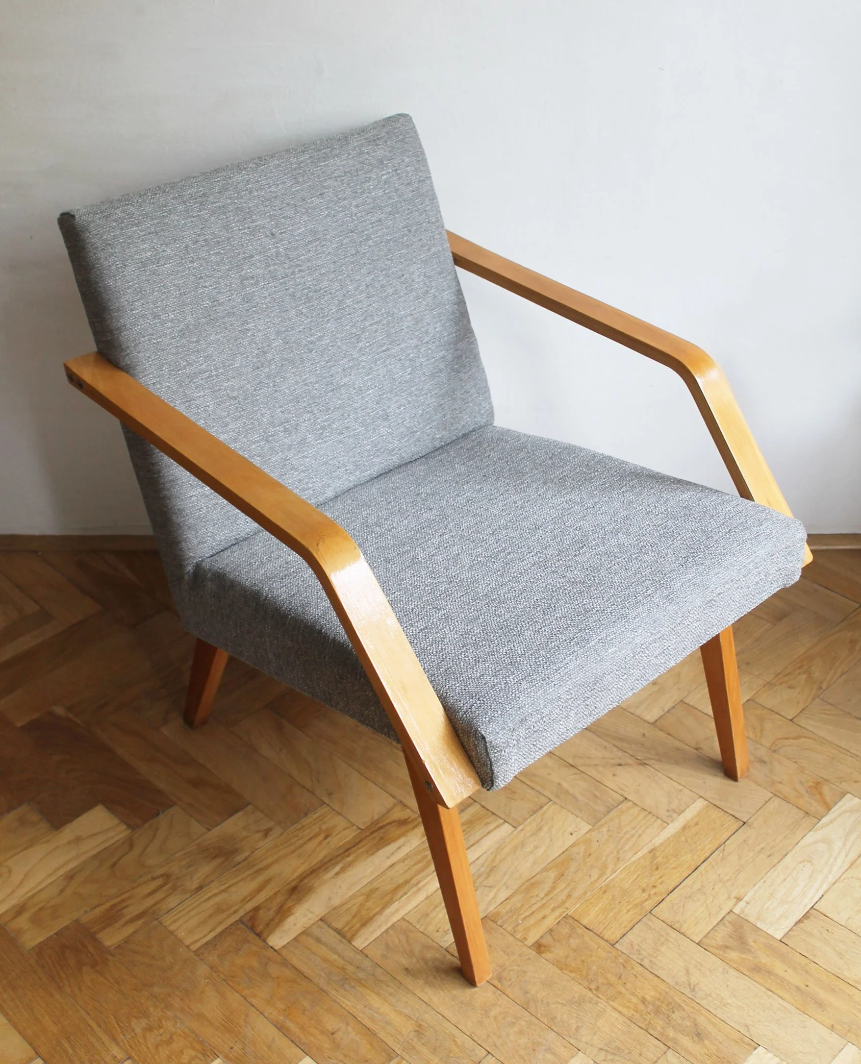 mid century armchair detail wood grain and fabric.jpg