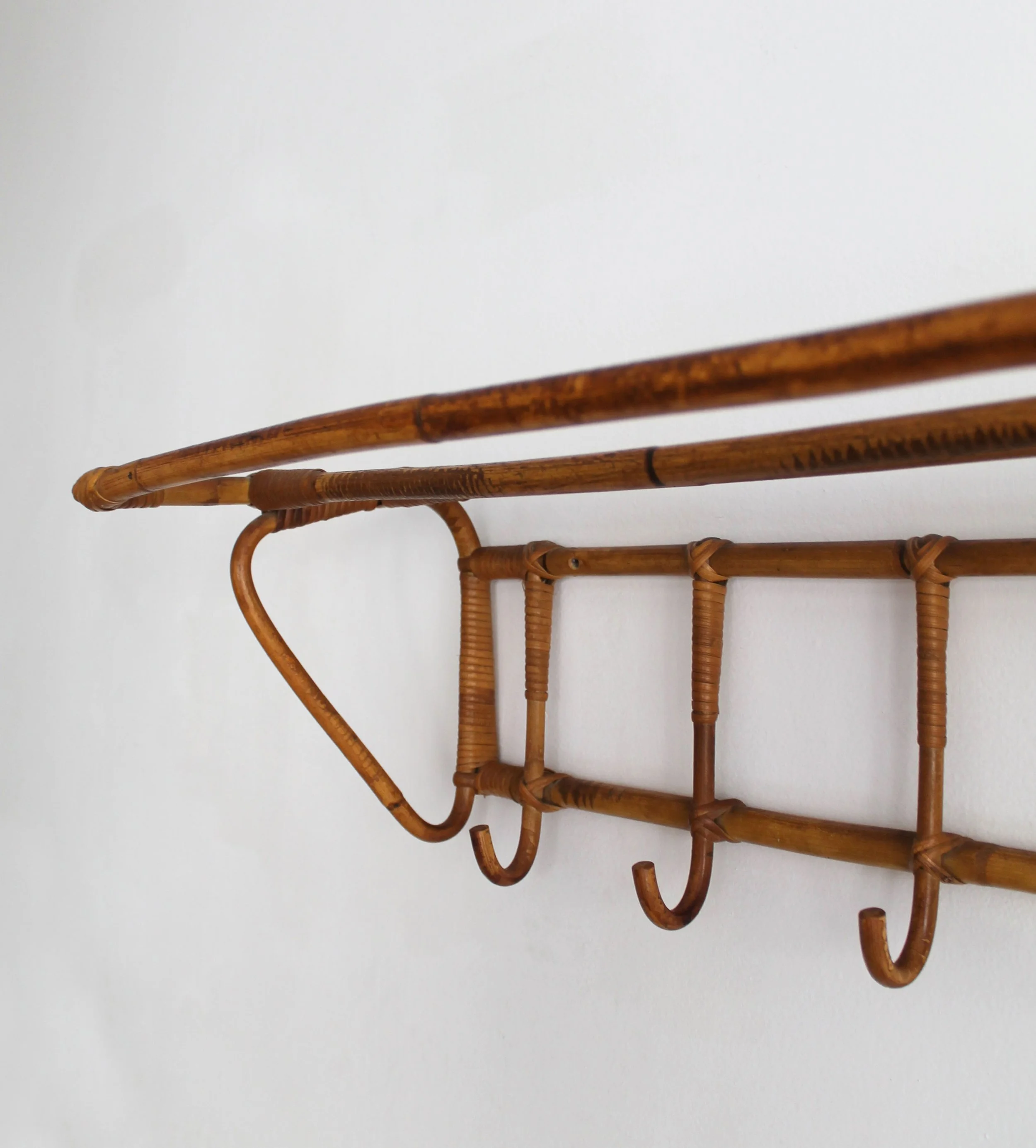Original warm patina and surface detail of vintage Czechoslovak rattan coat rack.jpg