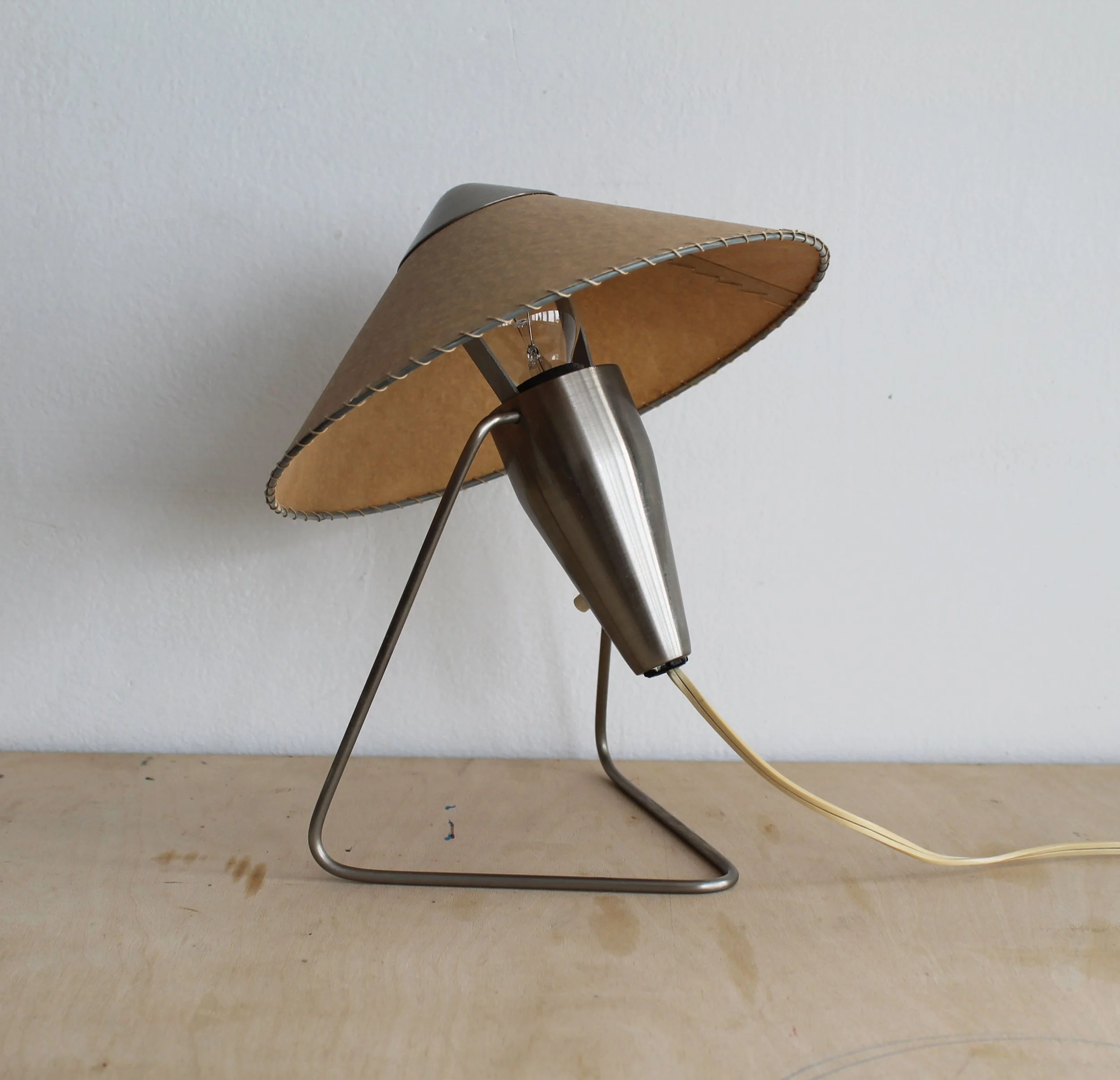 Bent steel frame and tapered metal body of Helena Frantová Číňanka table lamp.jpg