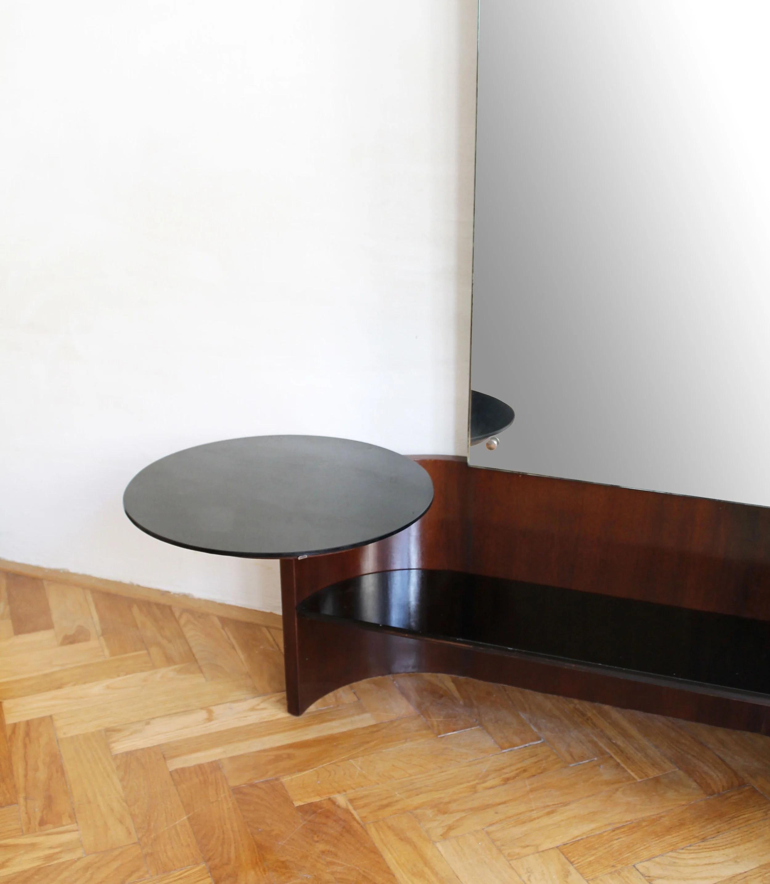 Side angle capturing the graceful projection of the circular opaxite side table.jpg