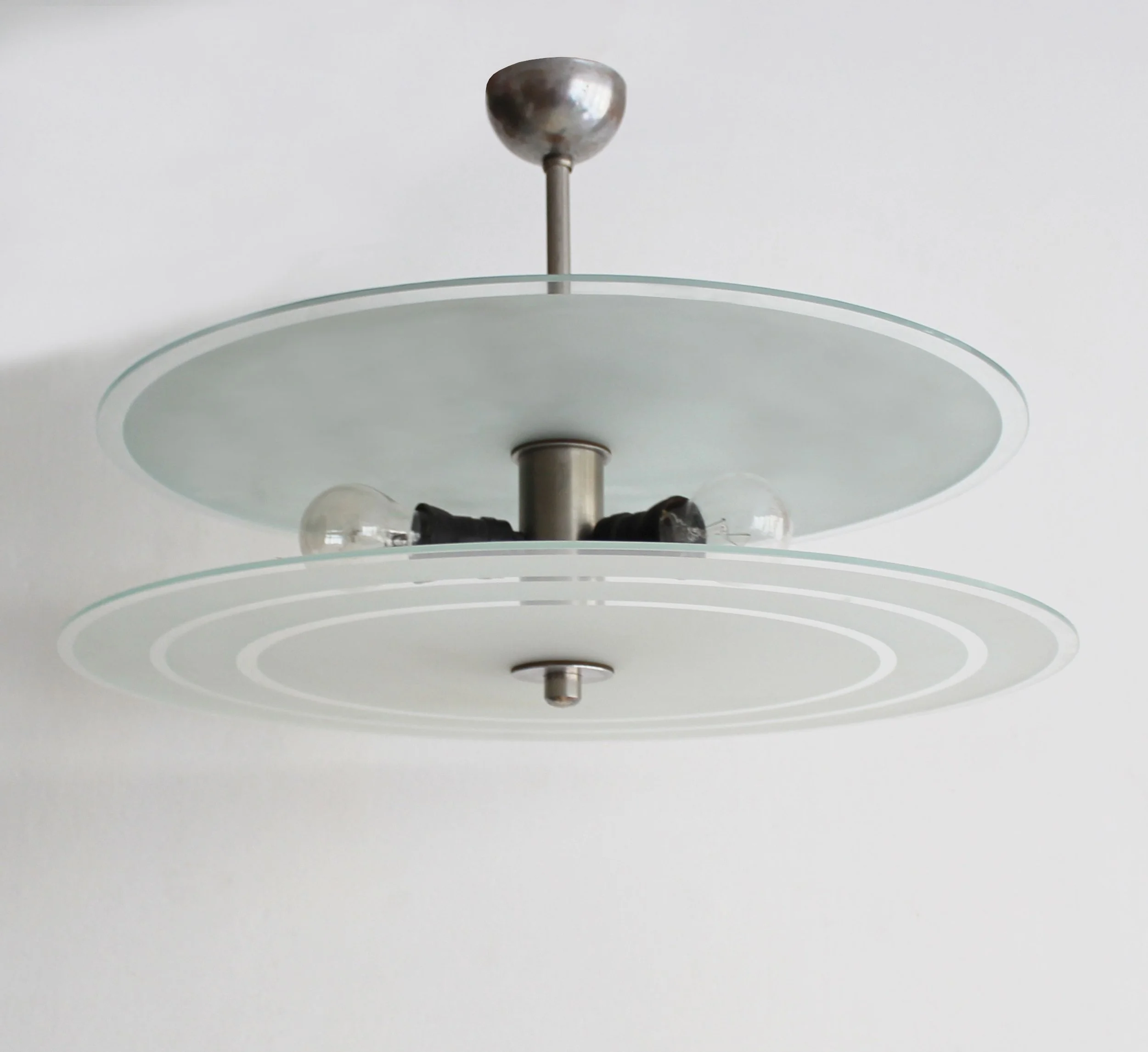 Elegant modernist ceiling lamp rescued from original villa interior.jpg