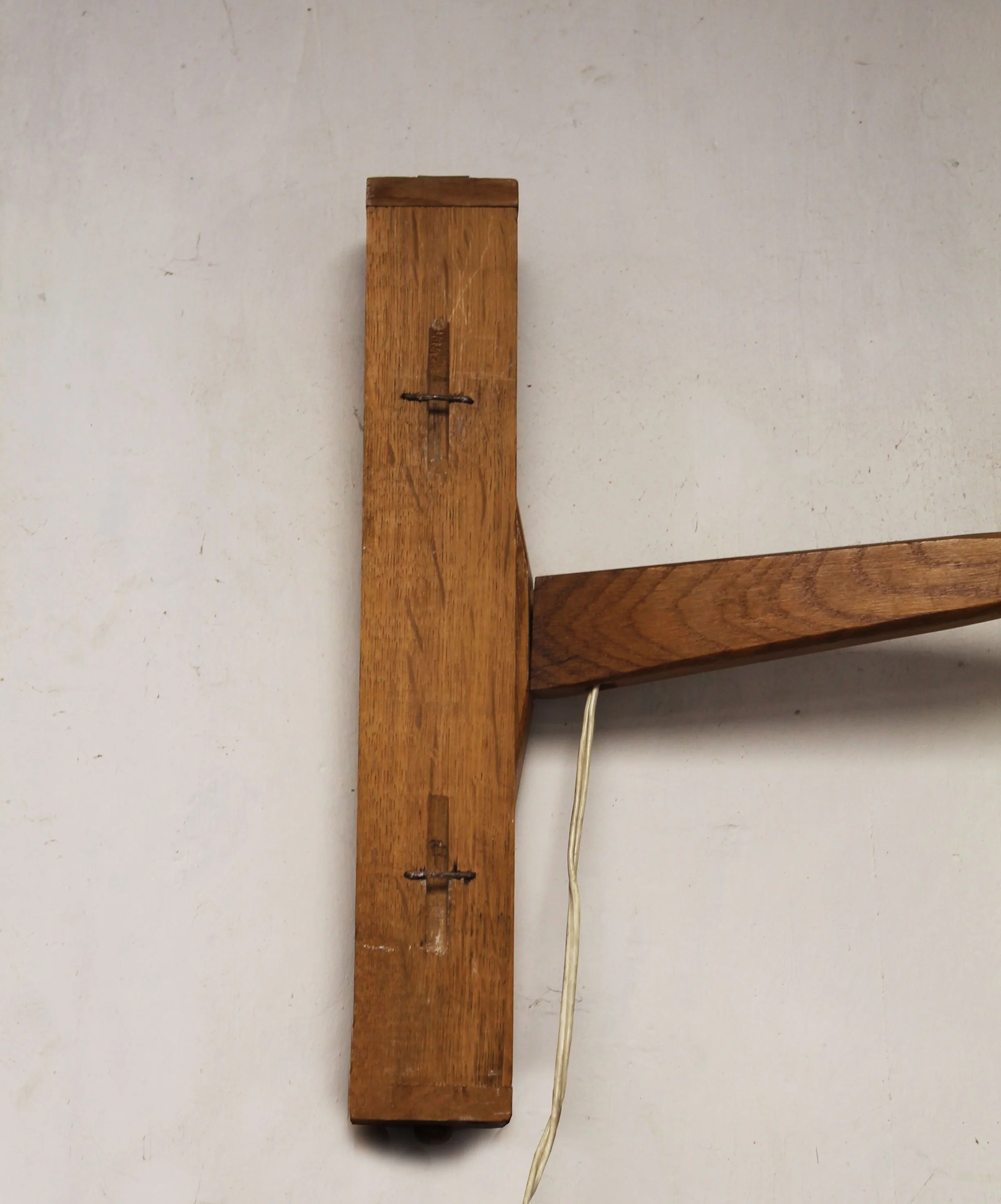 Reverse of the wooden wall plate showing its original mounting hardware and construction.jpg