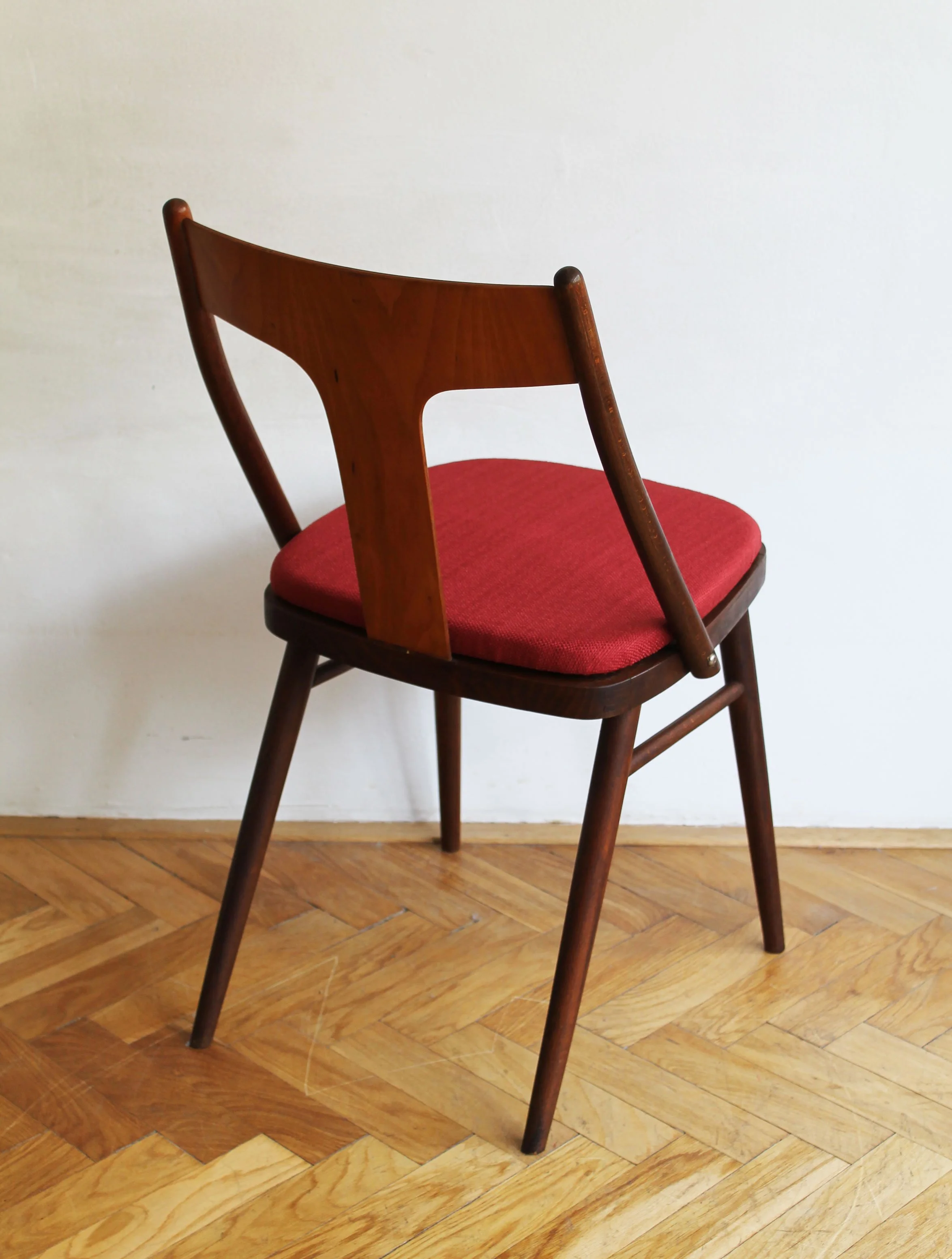 Set of restored 1960s dining chairs in dark stained wood.jpg