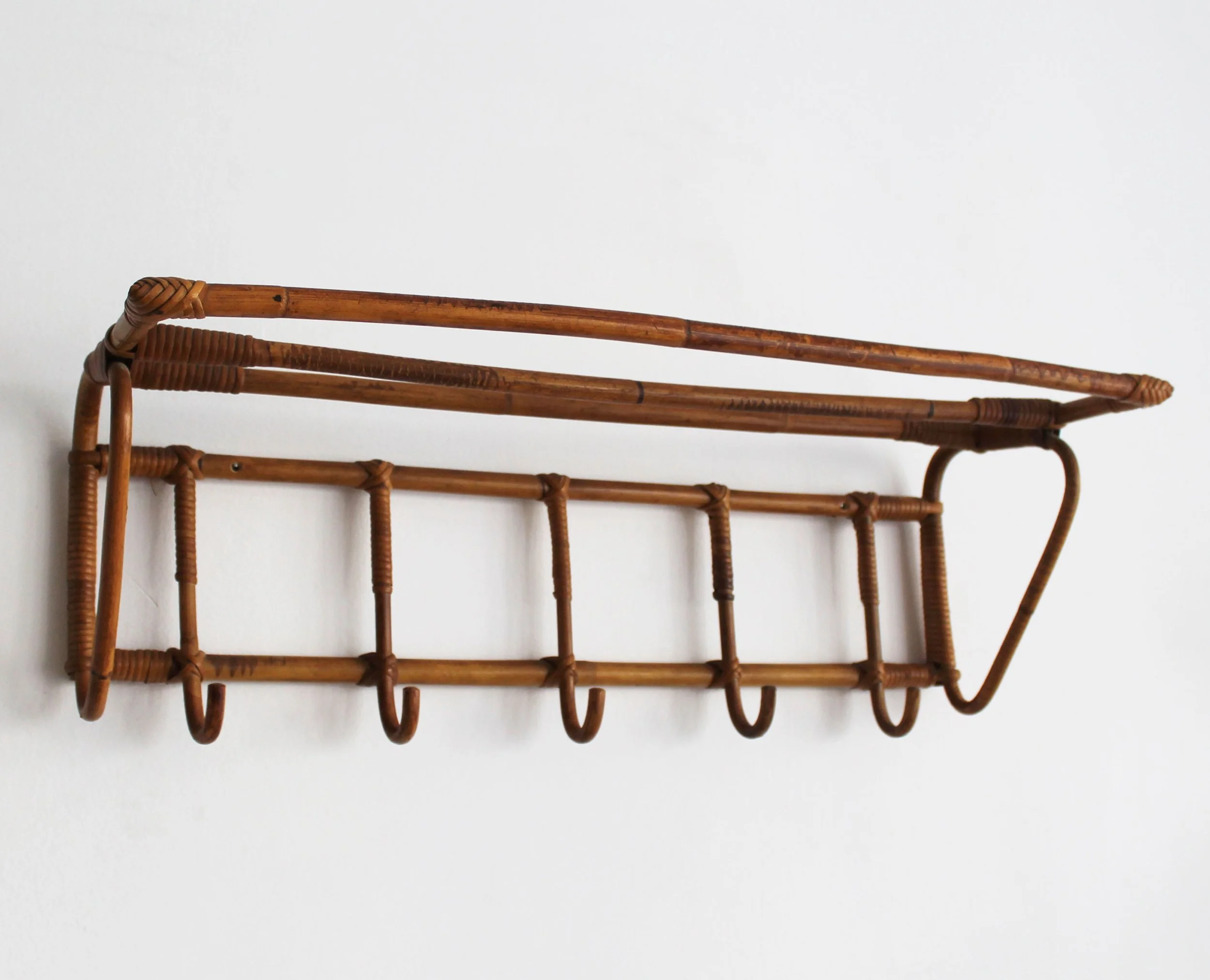 Side view of Czechoslovak rattan wall coat rack showing projecting hat shelf.jpg