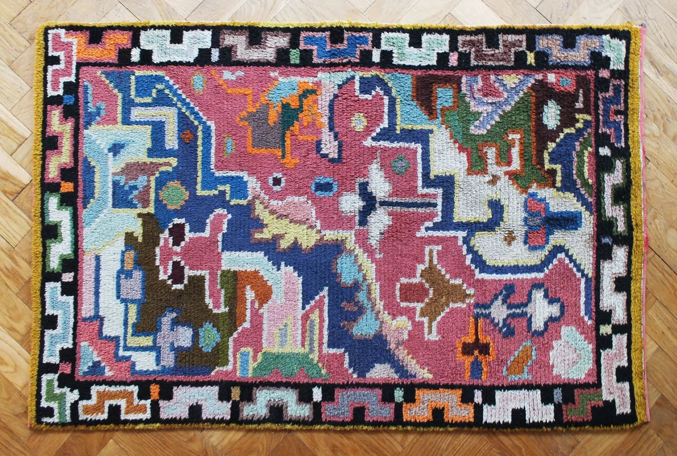 Vintage wool rug in bright mid-century colours and bold shapes.jpg