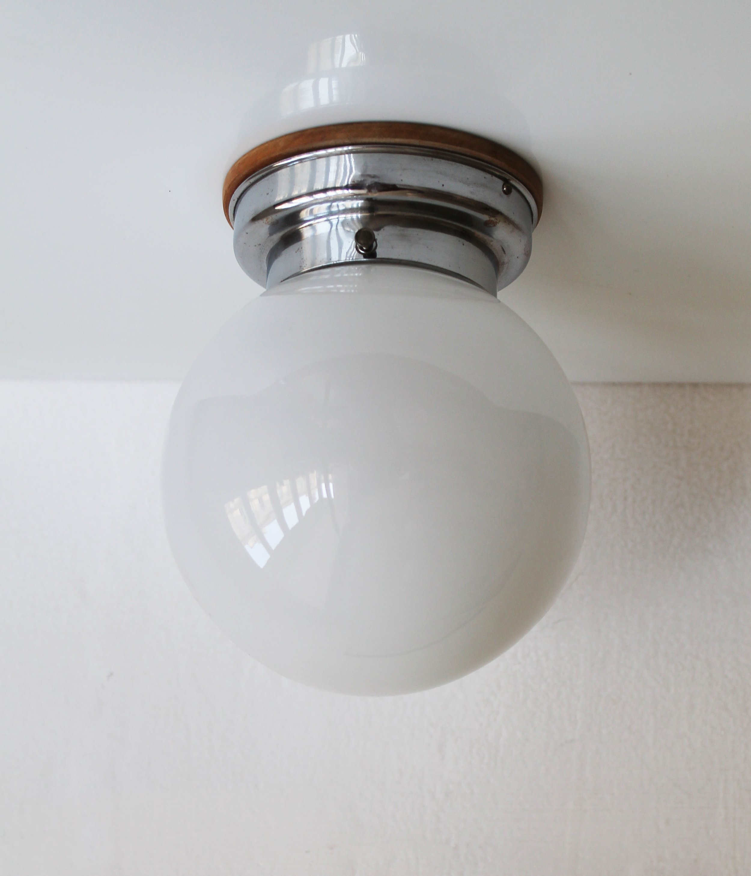 Functionalist ceiling light with exposed screws detail.jpg