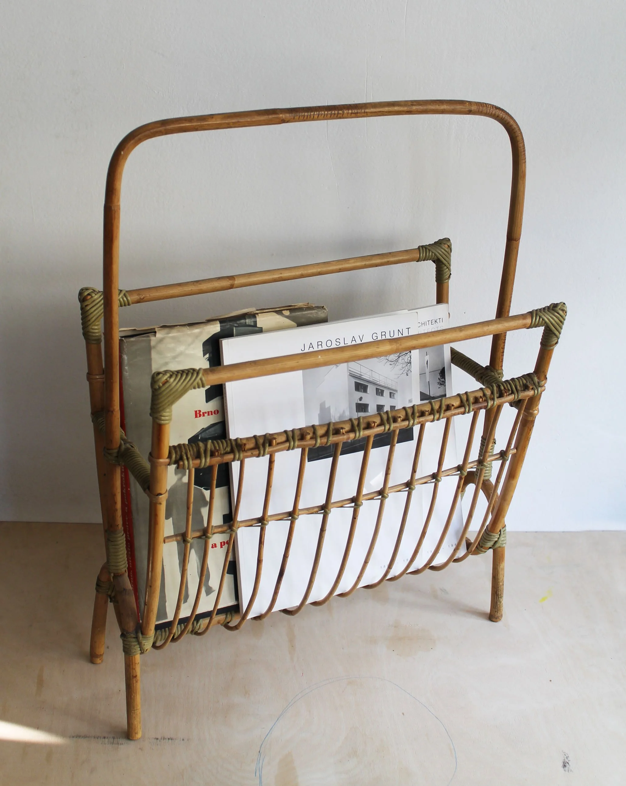 Close-up of original cane, rattan bindings and natural vintage patina on 1960s Czechoslovak magazine rack