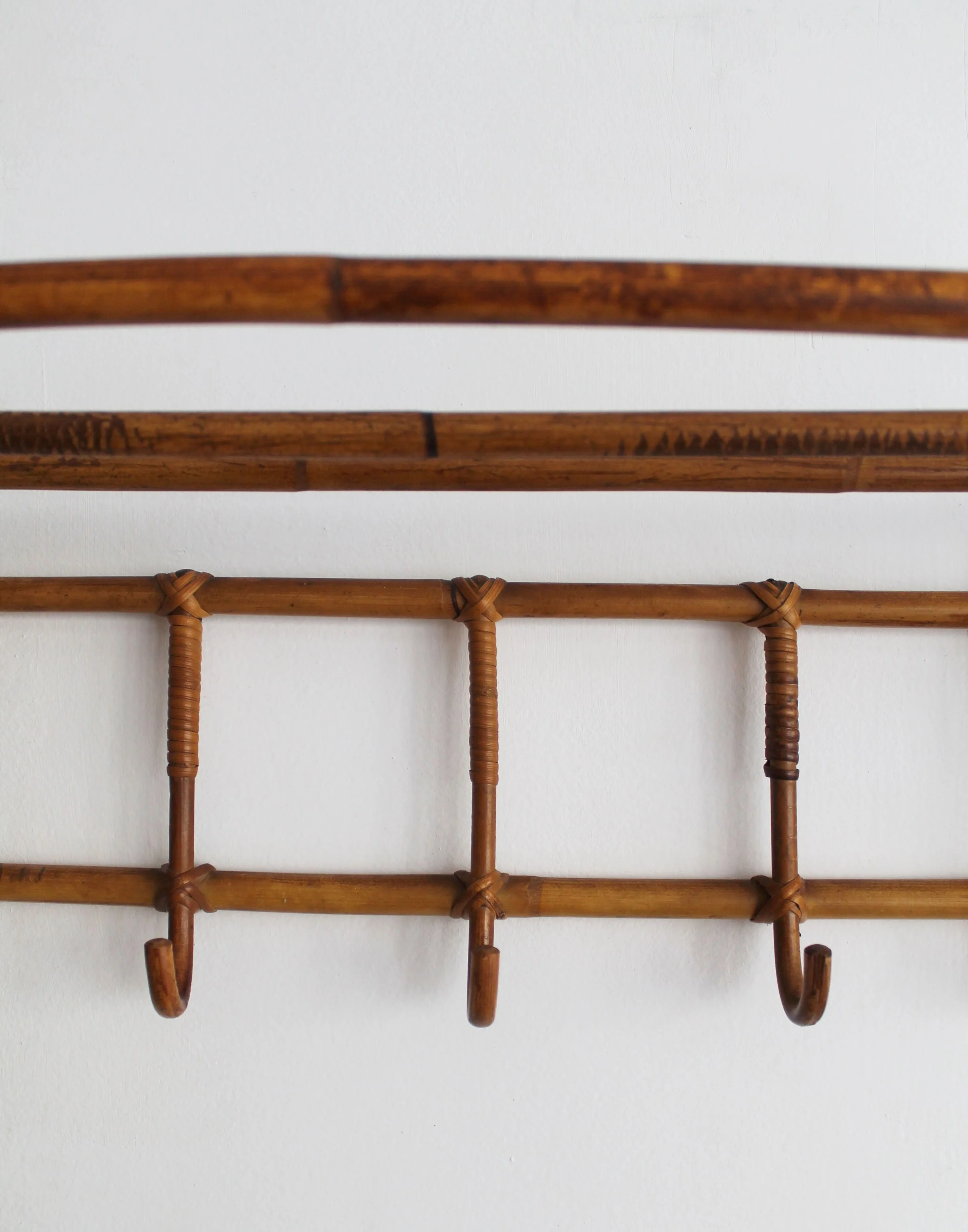 Five bent cane coat hooks on vintage Czechoslovak wall-mounted coat rack.jpg