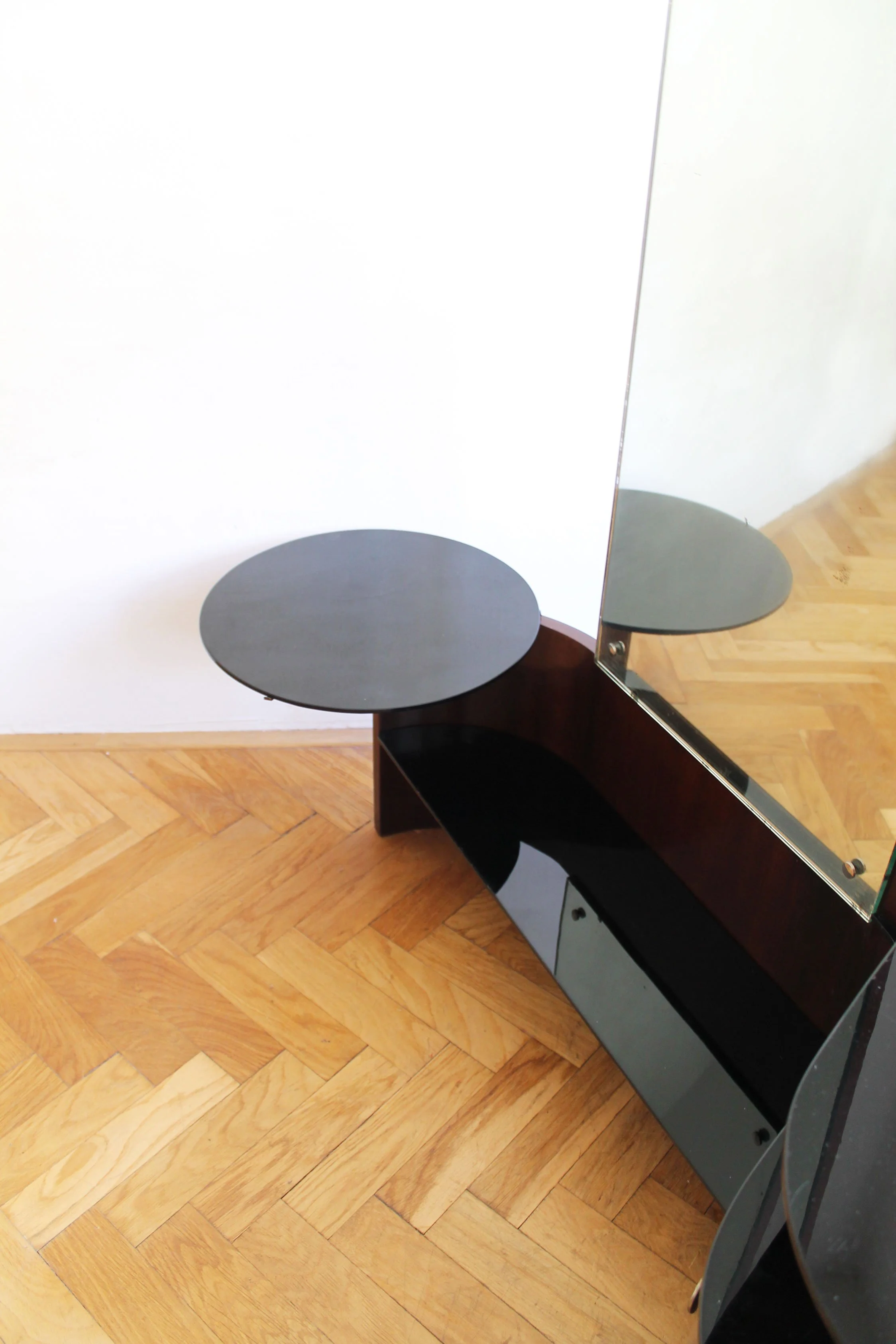 Close-up of the black opaxite glass surfaces, reflecting the quality materials used in the vanity.jpg