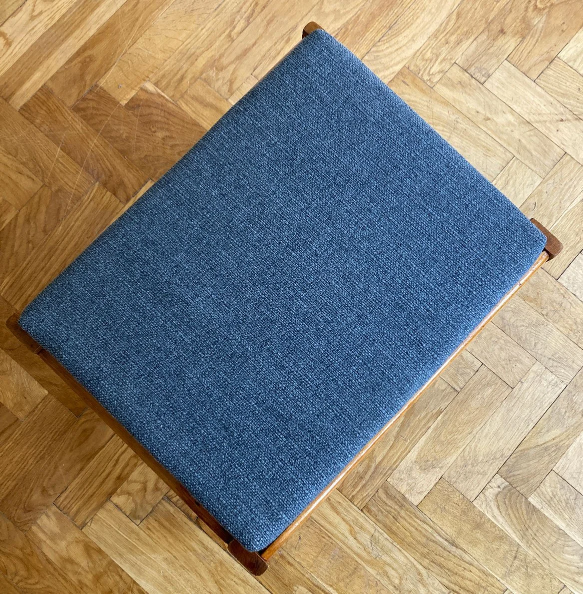 Compact mid-century wooden stool suitable as seating or side table.jpg