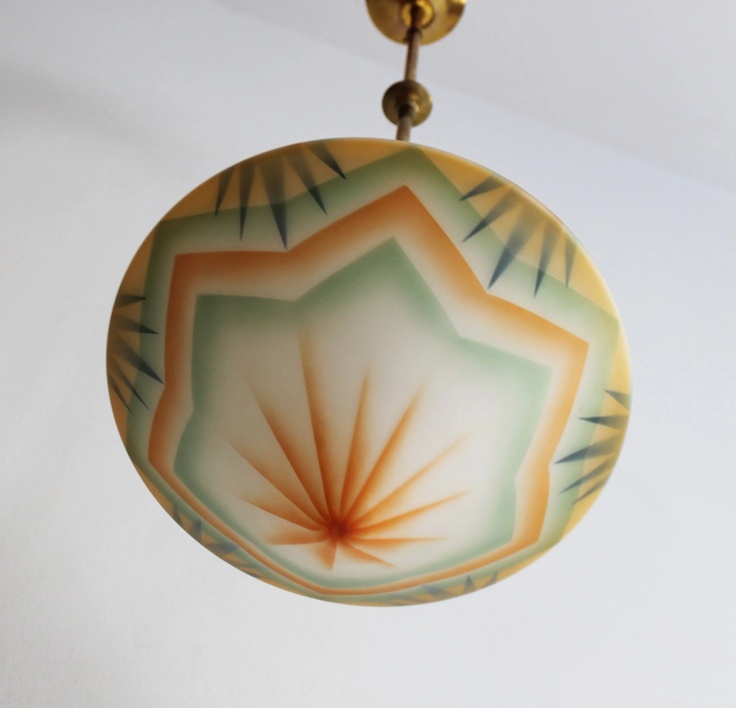 Rare collectible Art Deco ceiling light with warm orange and green accents.jpg