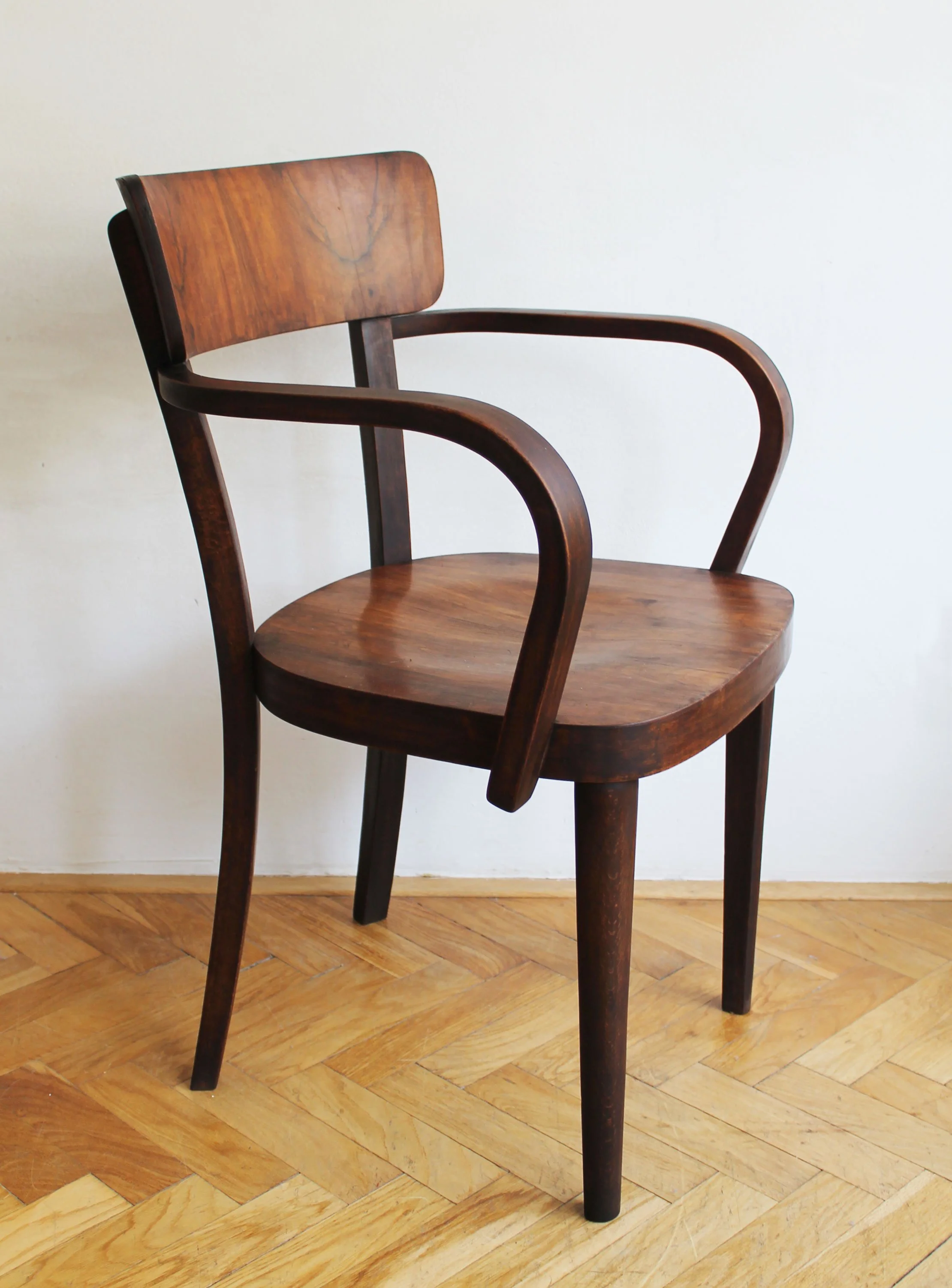 Close-up of walnut veneer grain on vintage chair.jpg