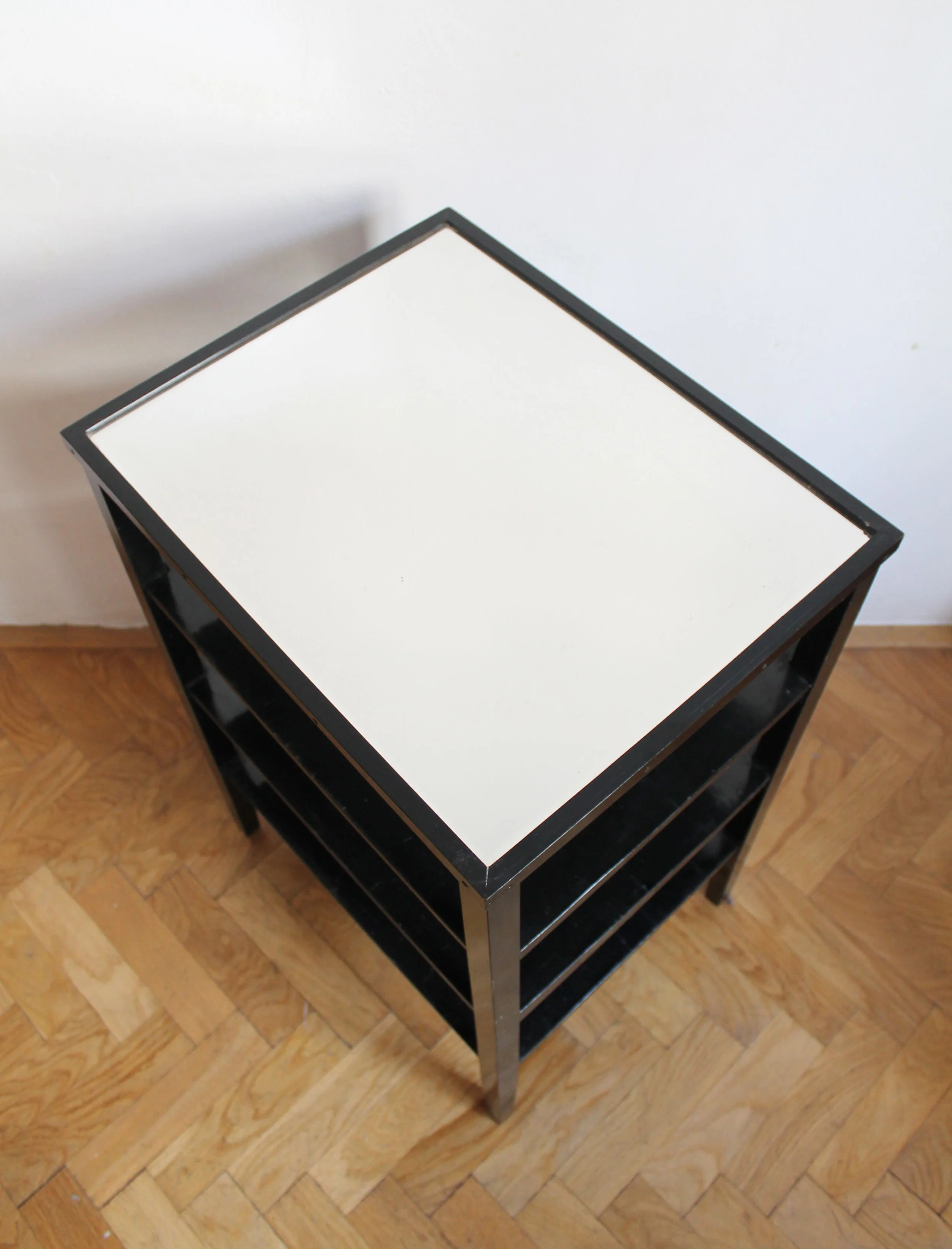 Bevelled inset glass top of a late 1940s Czechoslovak Modernist side table.jpg