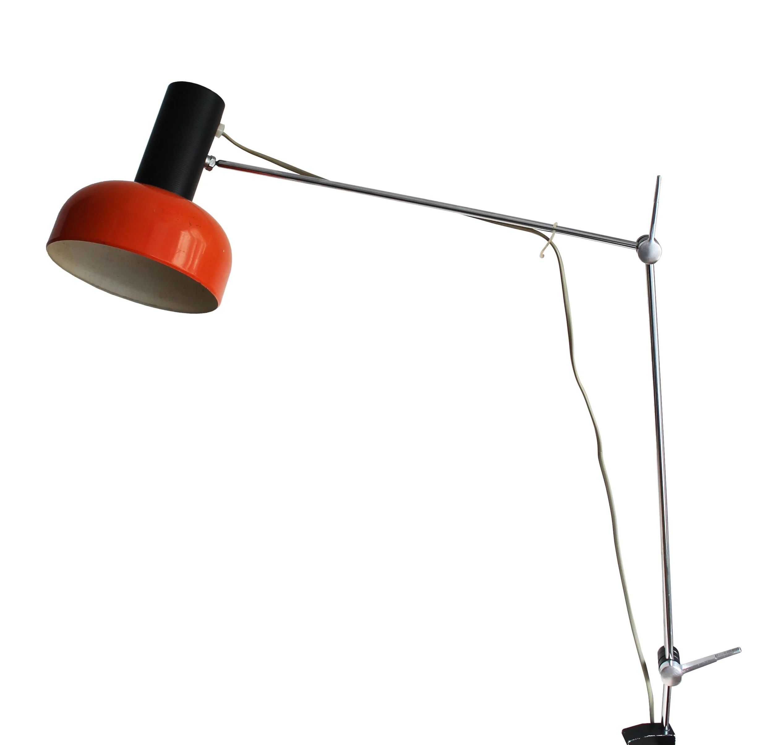 Full side view of a 1970s NAPAKO adjustable clamp desk lamp with an orange shade and extended chrome arm.