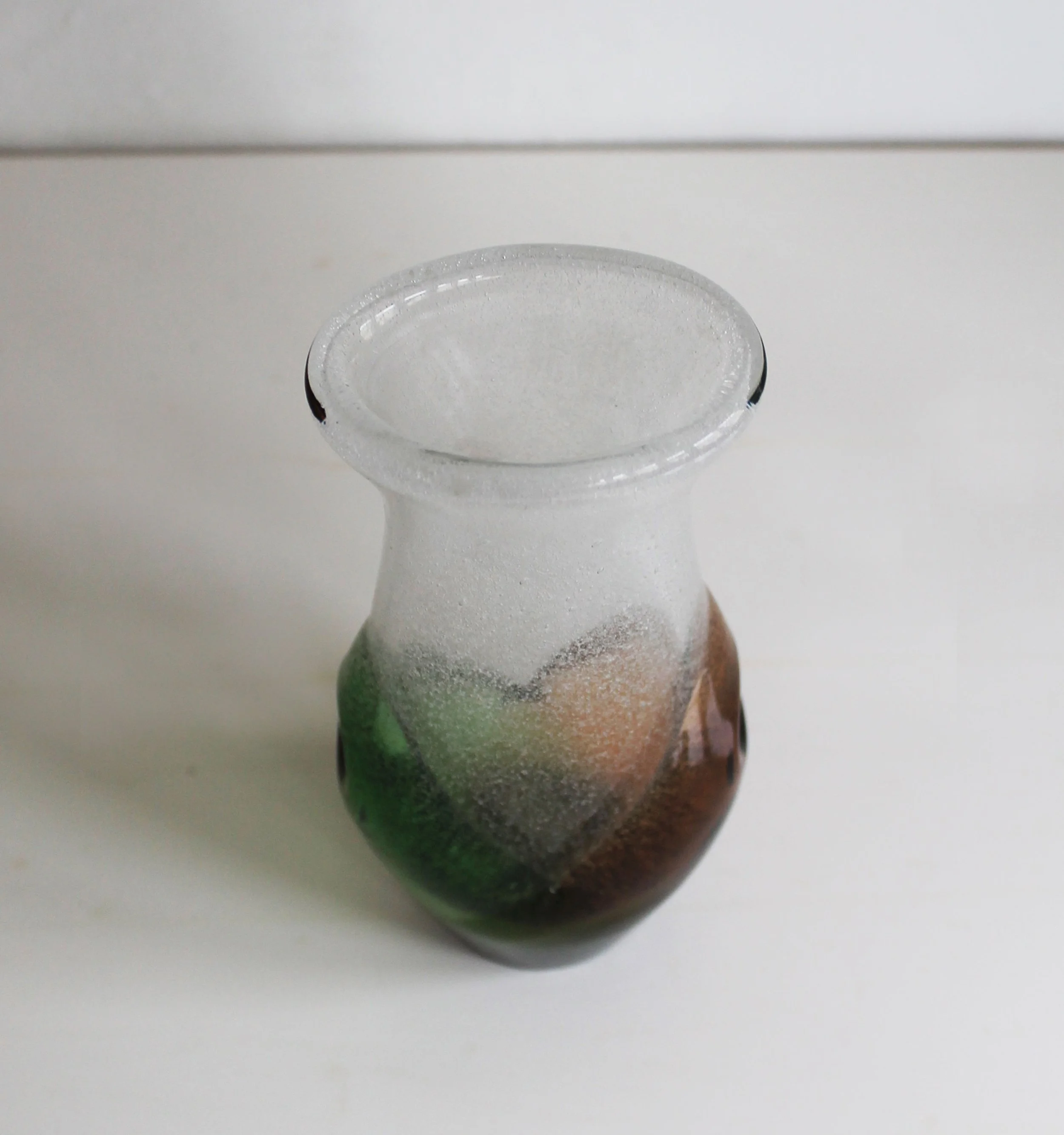 Bohemian sculptural glass vase in green and brown tones.jpg