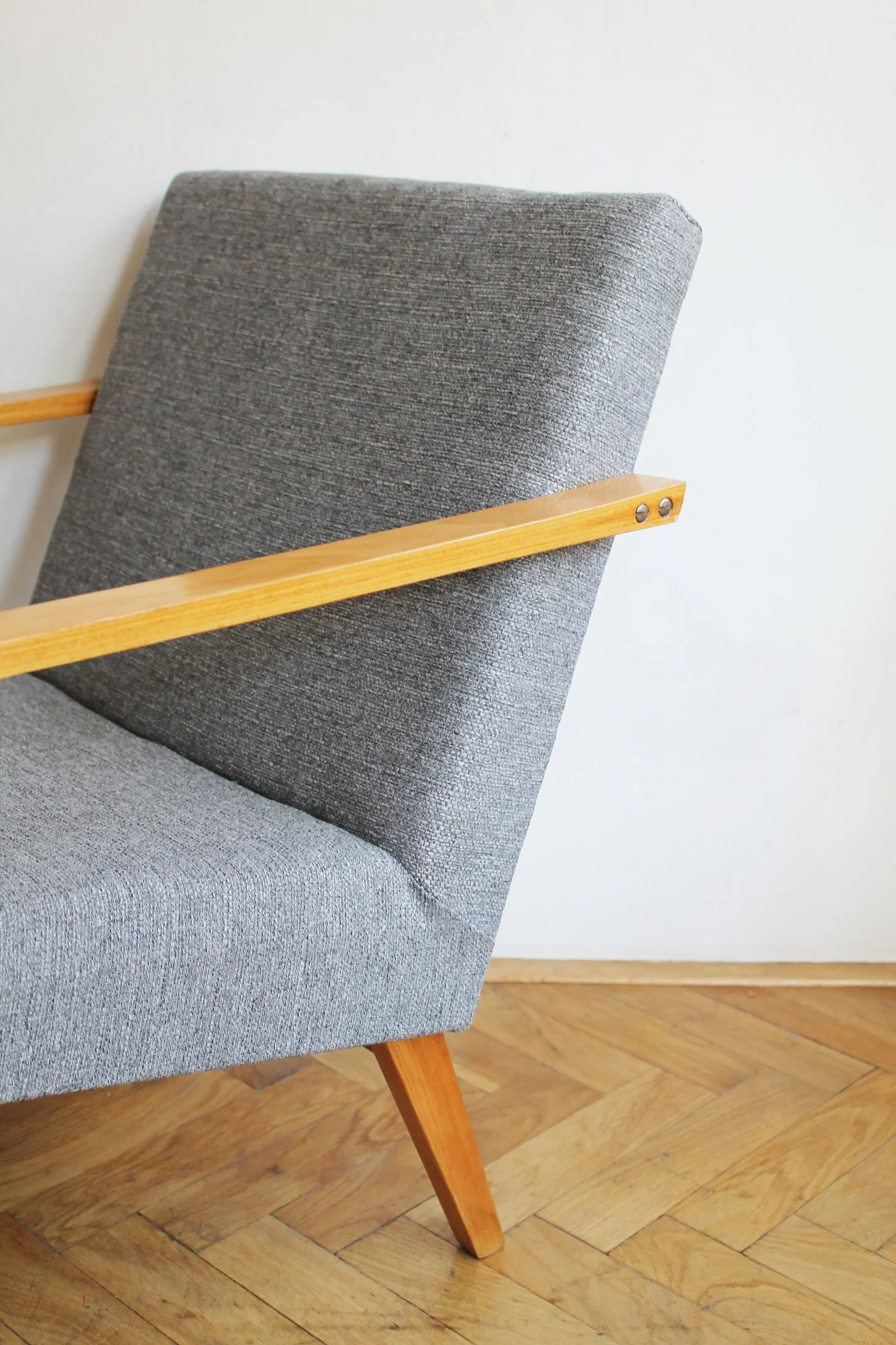 restored wooden armchairs with soft grey fabric.jpg