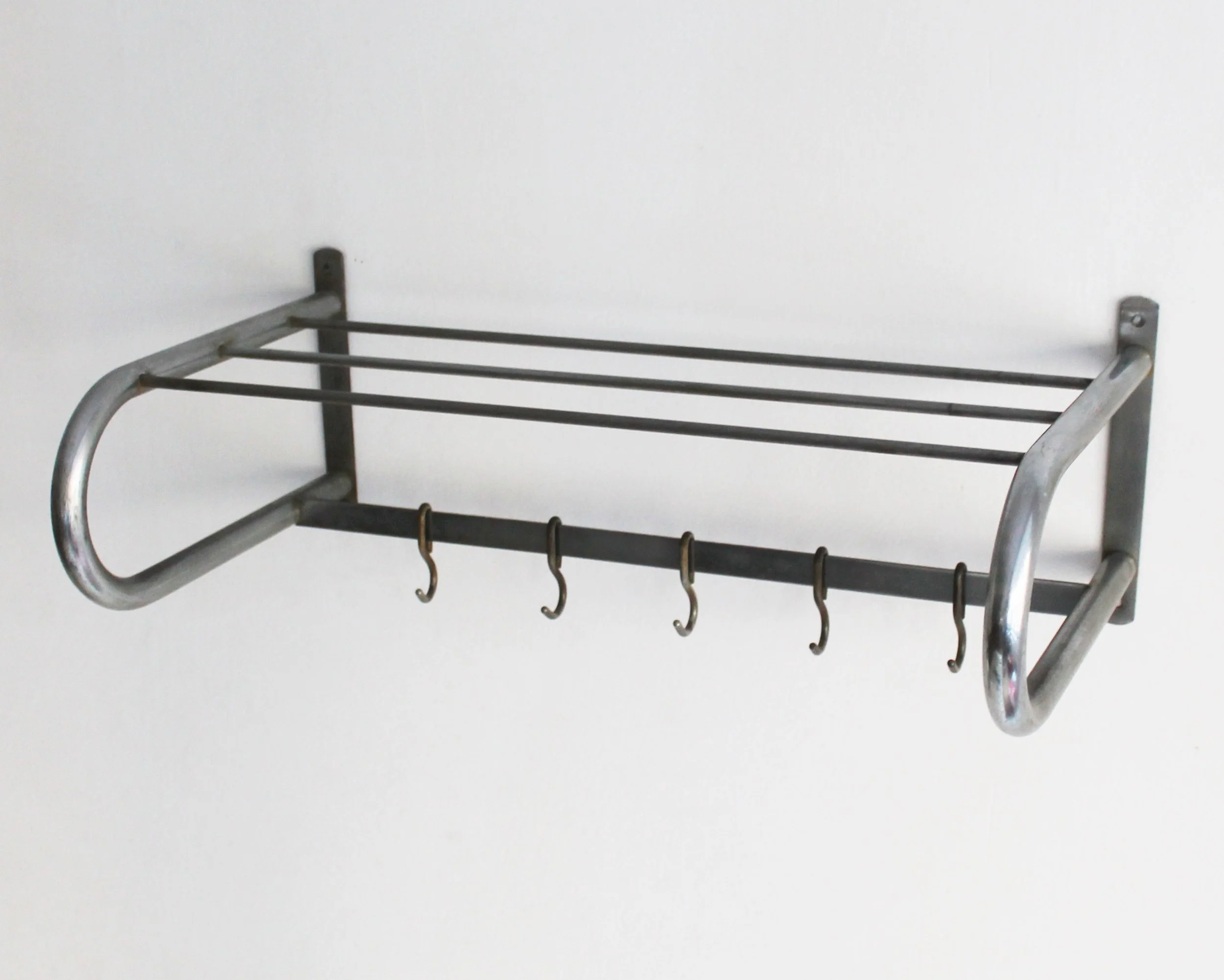 Modernist Czech hallway rack with tubular steel loops and six metal hooks, available at By Barnabas.jpg