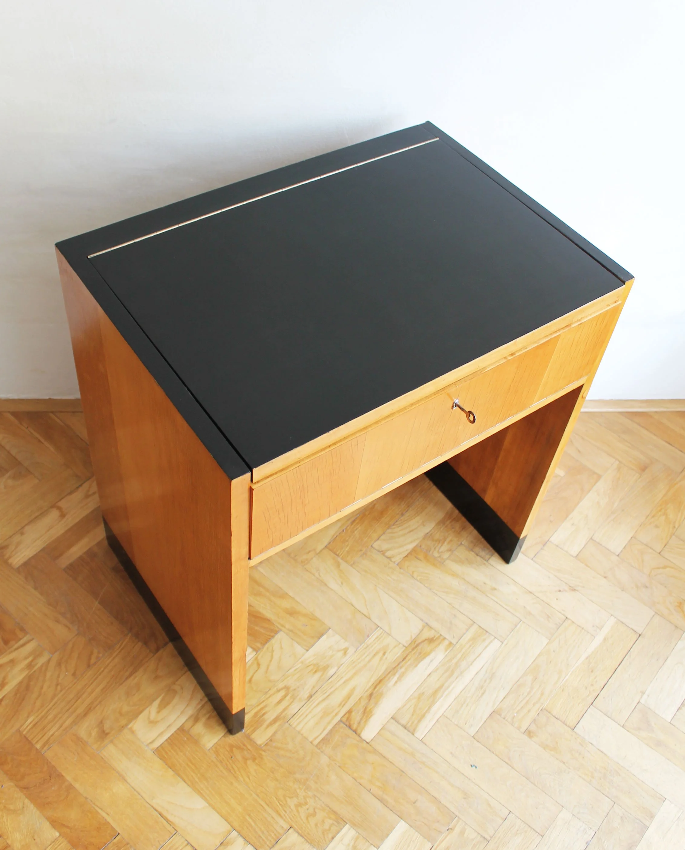 Close-up of birch wood grain and black-painted accents.