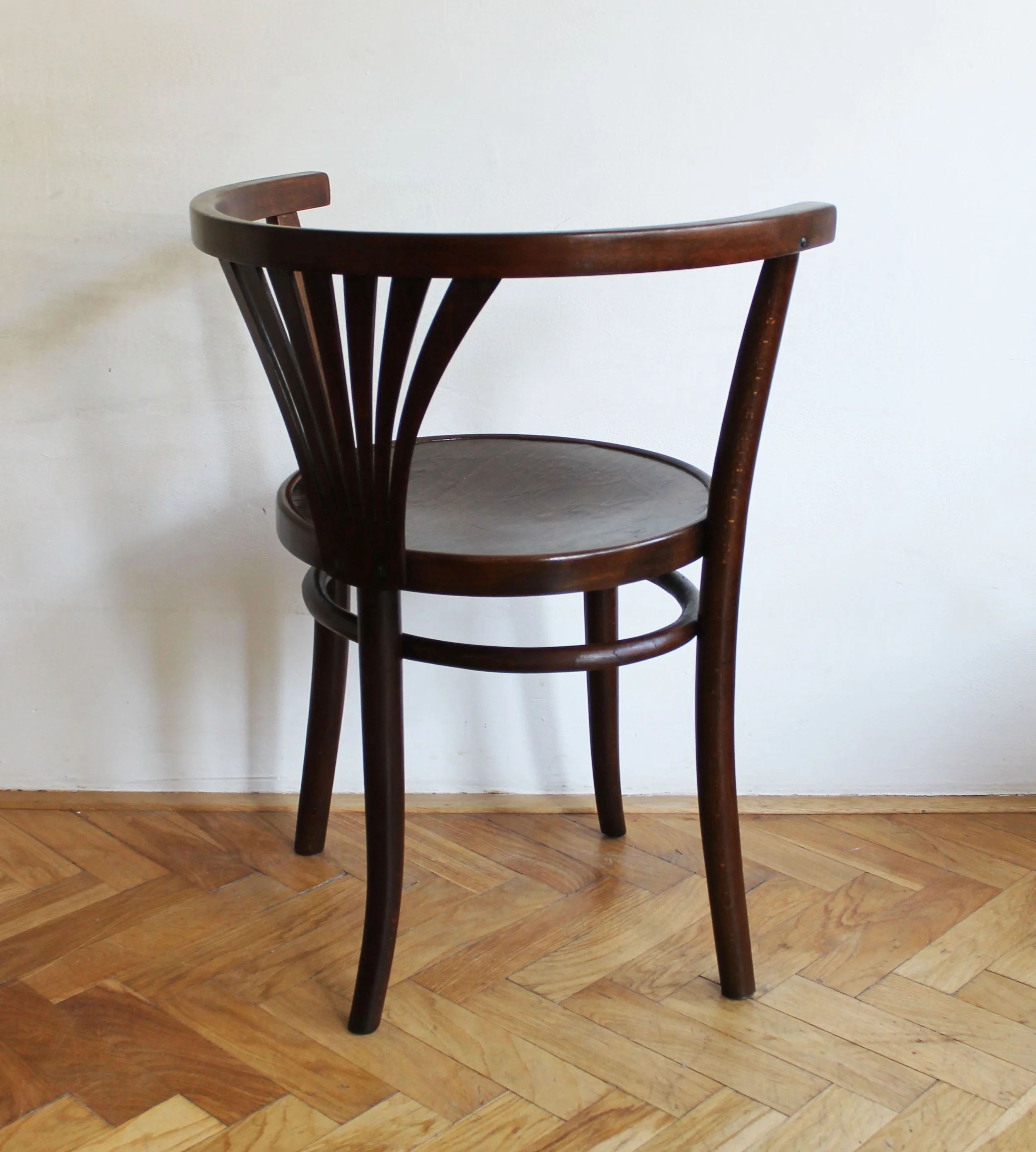 Czech vintage bentwood chair with curved backrest and embossed wooden seat.jpg