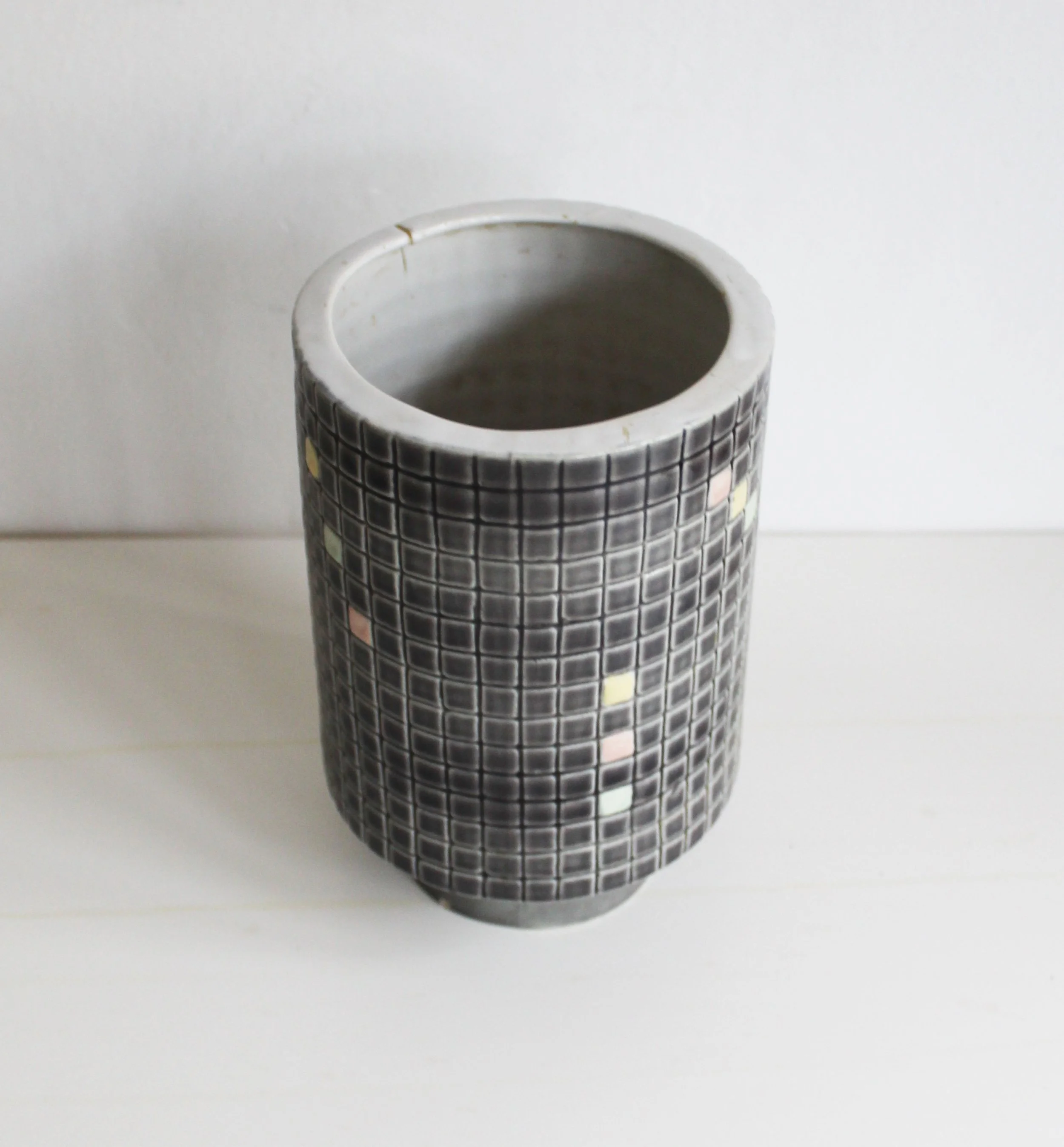 Cylindrical ceramic vase with narrow base.jpg