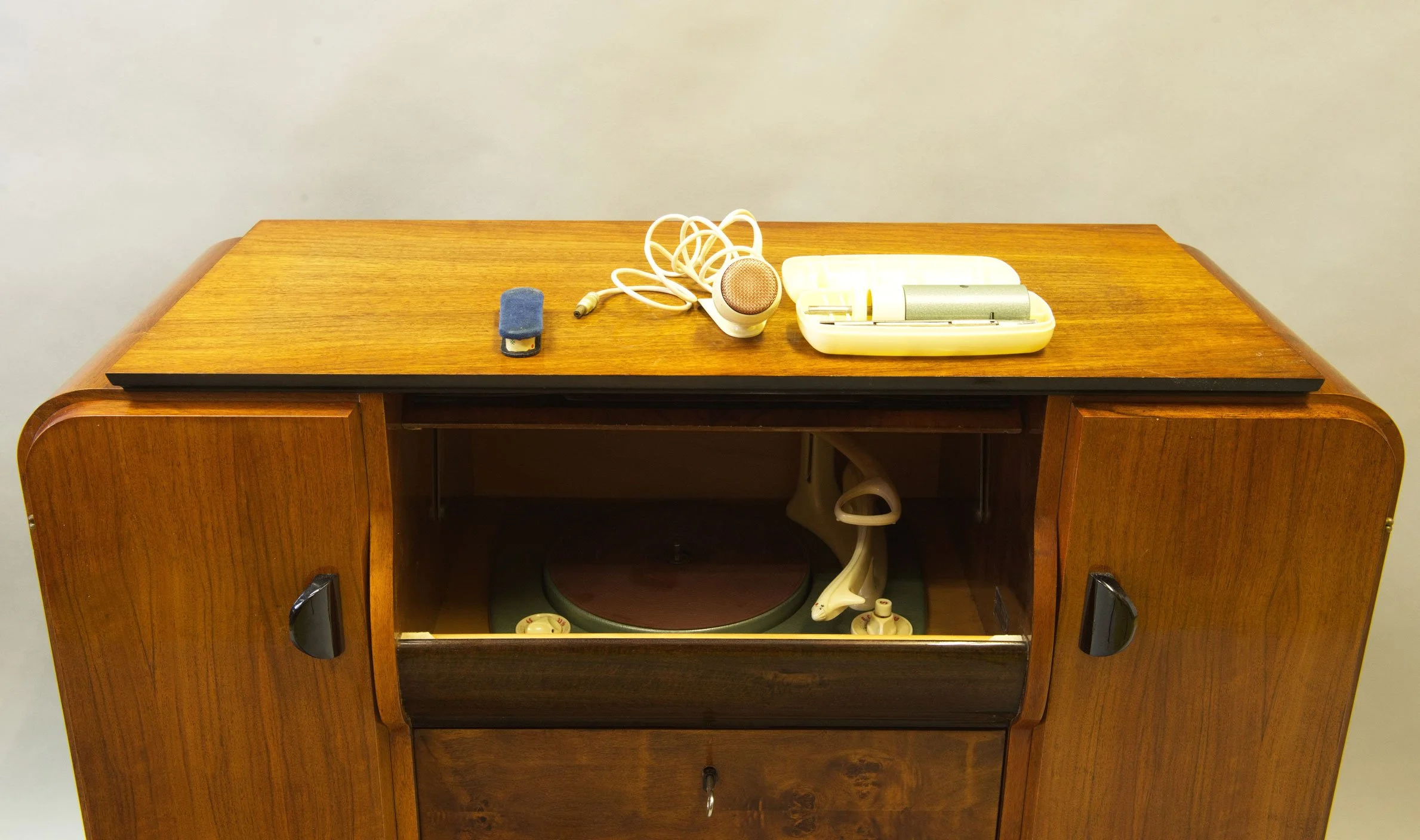 Interior of 1950s record cabinet with original speaker and wiring.jpg