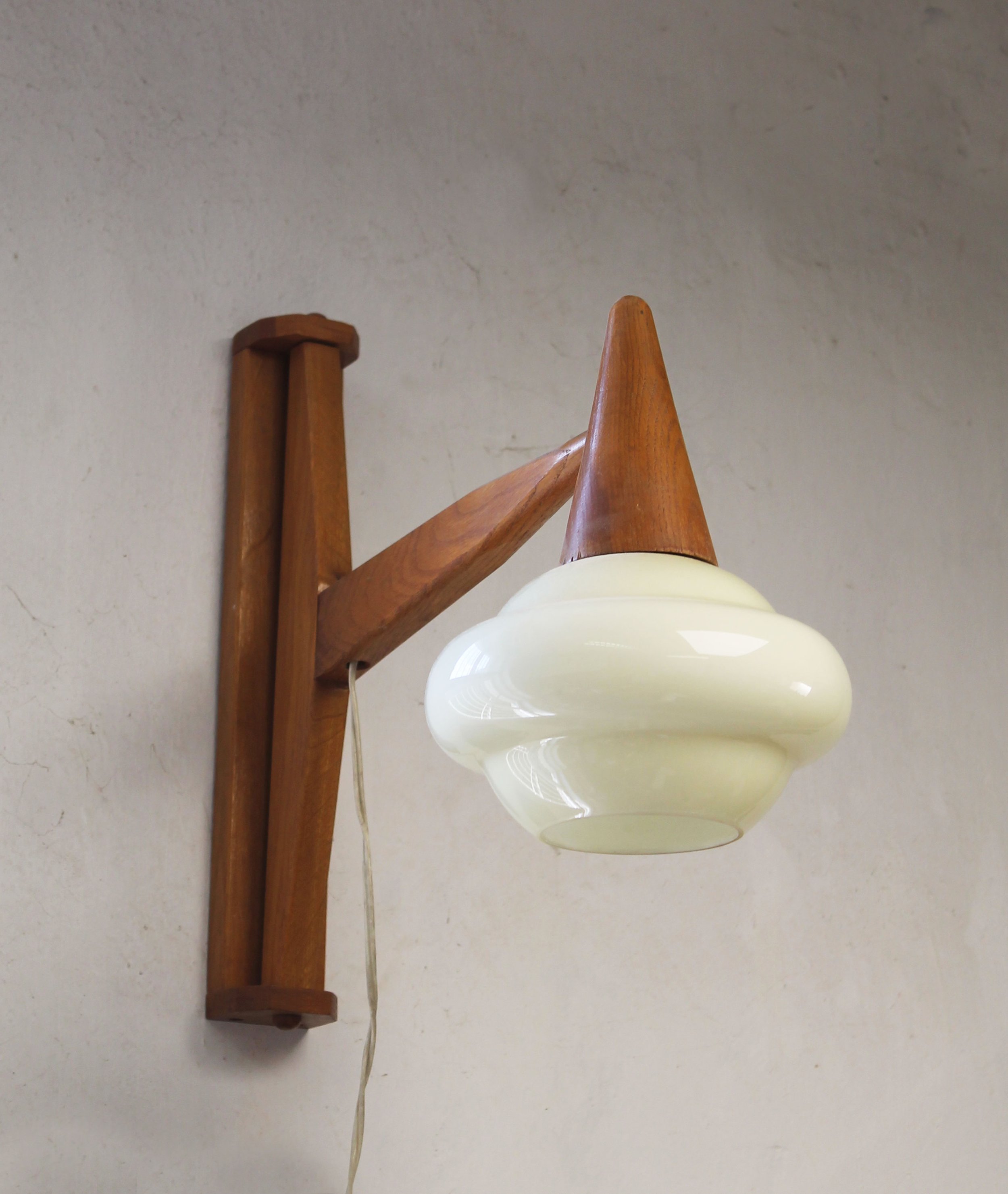 Angled view of the original 1960s wooden construction and opaline glass shade.jpg