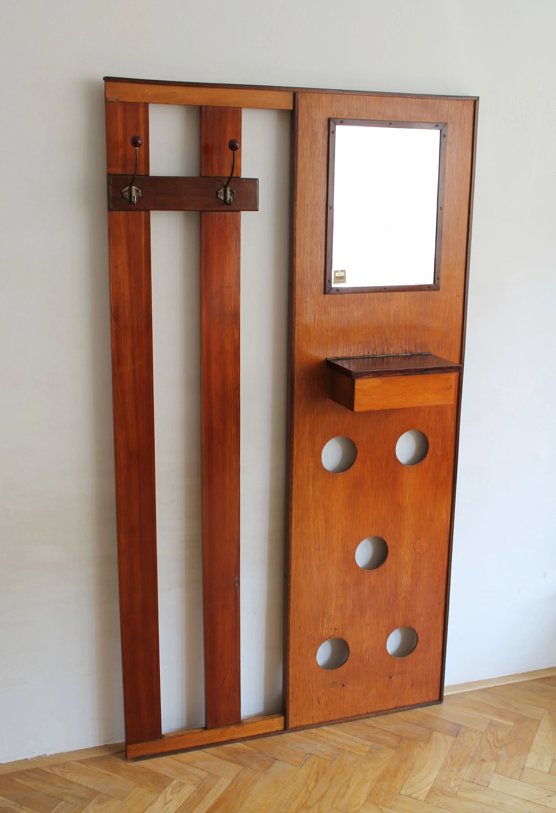Mid-century wooden coat hanger with circular cut-outs and small key compartment.jpg (Copy)