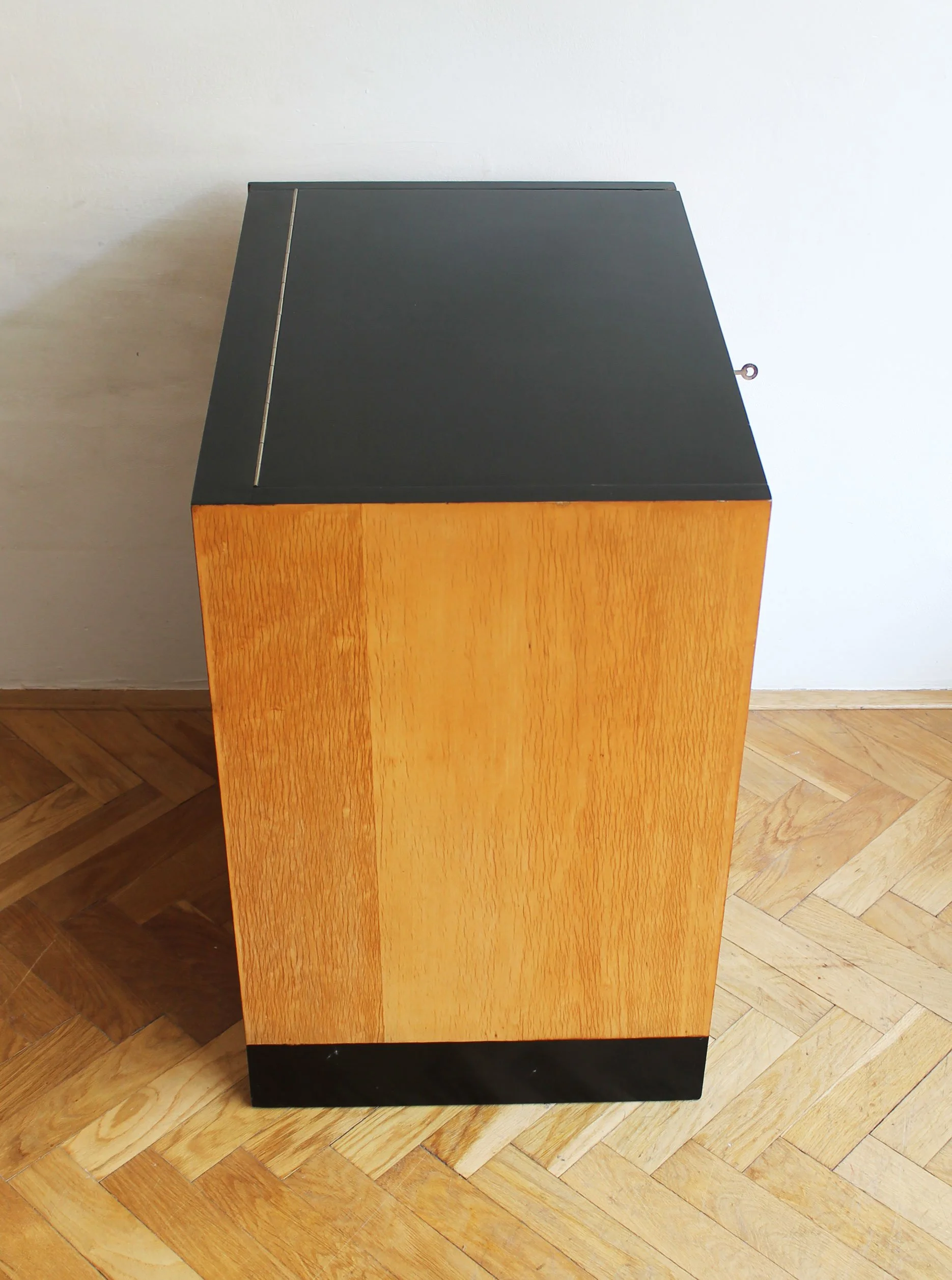 Open flap in horizontal position forming a small shelf.