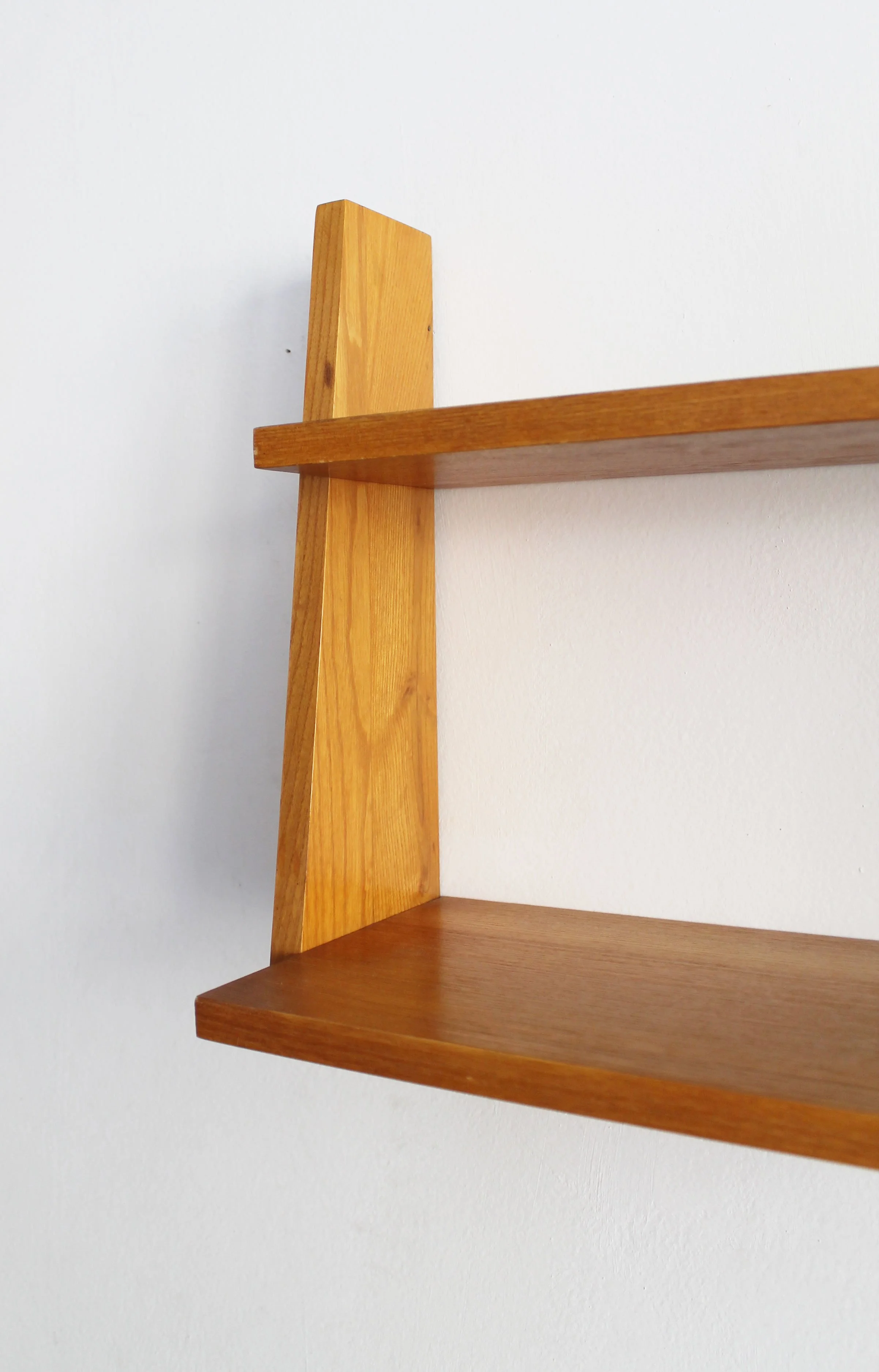 Detail of angled beech side support on 1960s Czechoslovak mid-century wall shelf