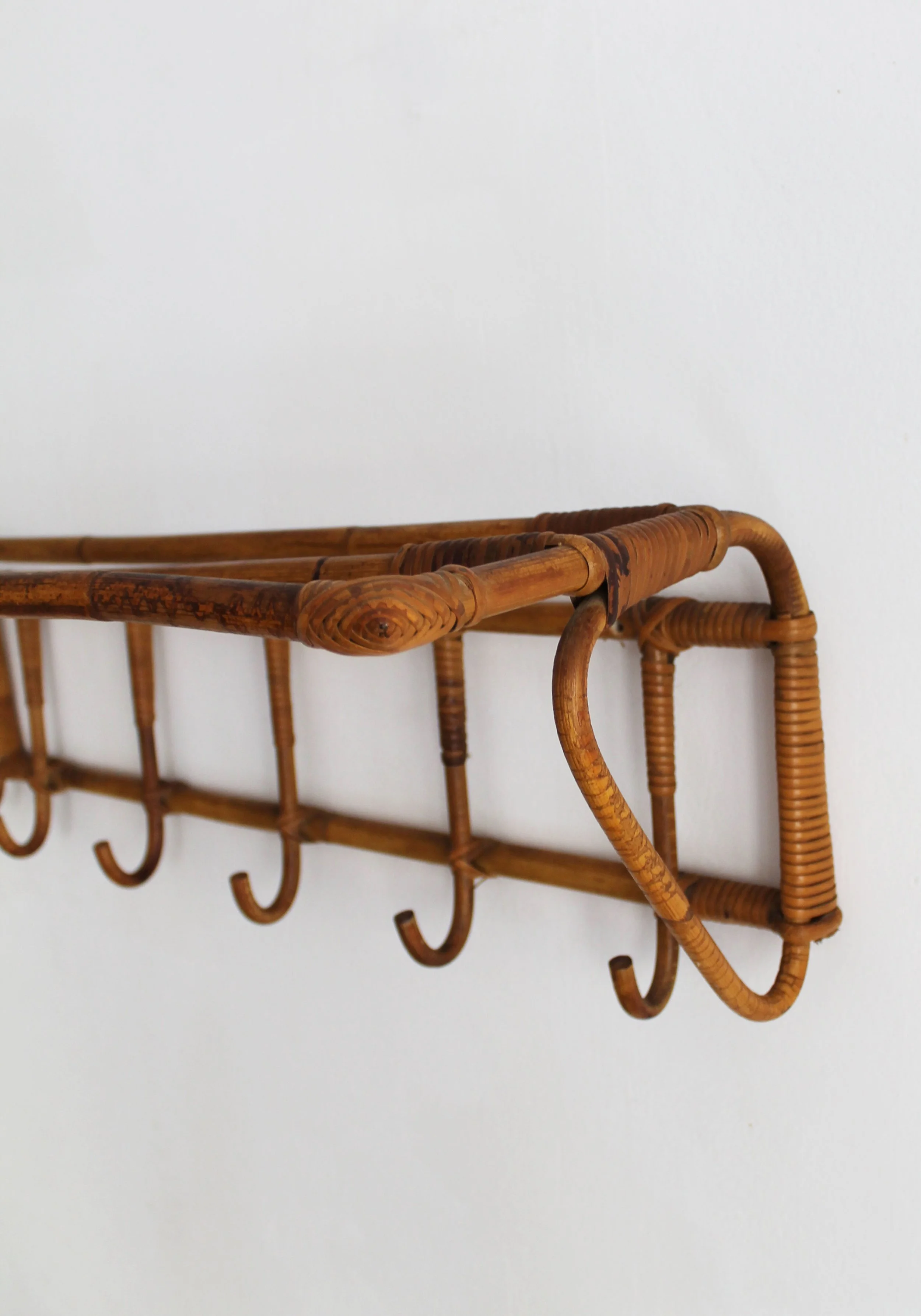 Hand-crafted wicker joint detail on Czechoslovak mid-century wall coat rack.jpg