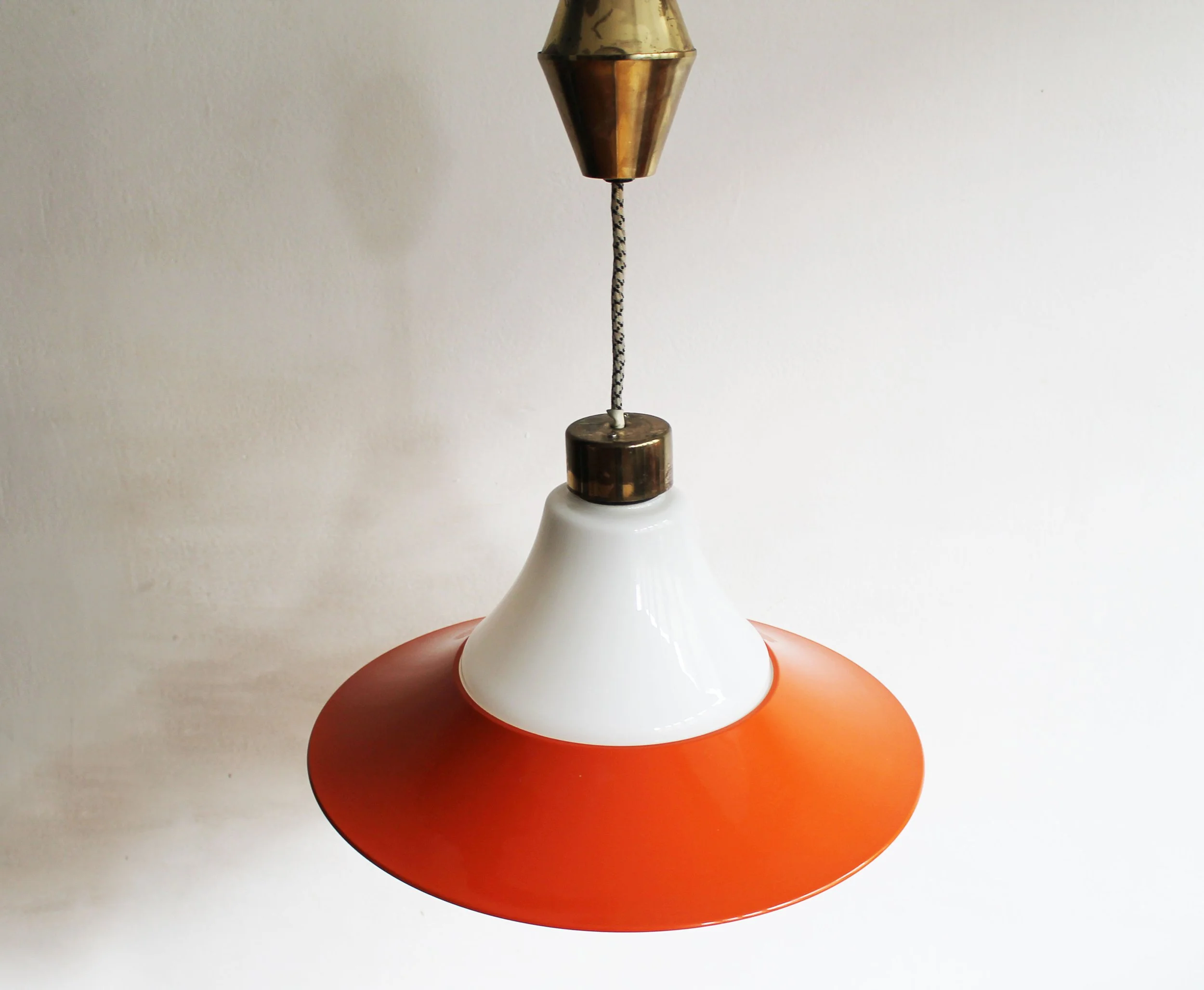 Orange-red painted metal frame and steel ring of pendant light.jpg